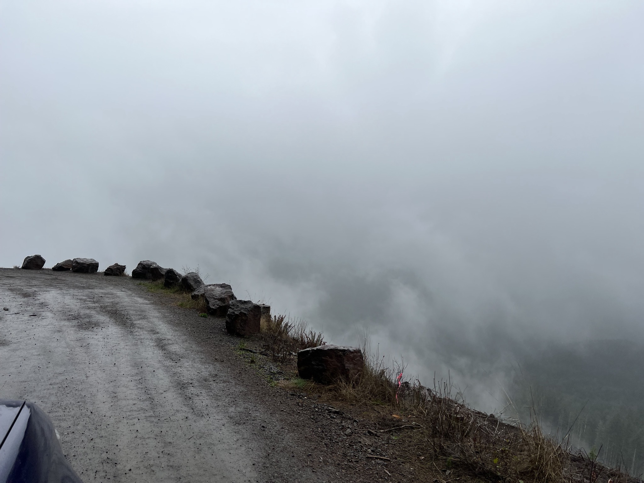 clouds next to dirt road