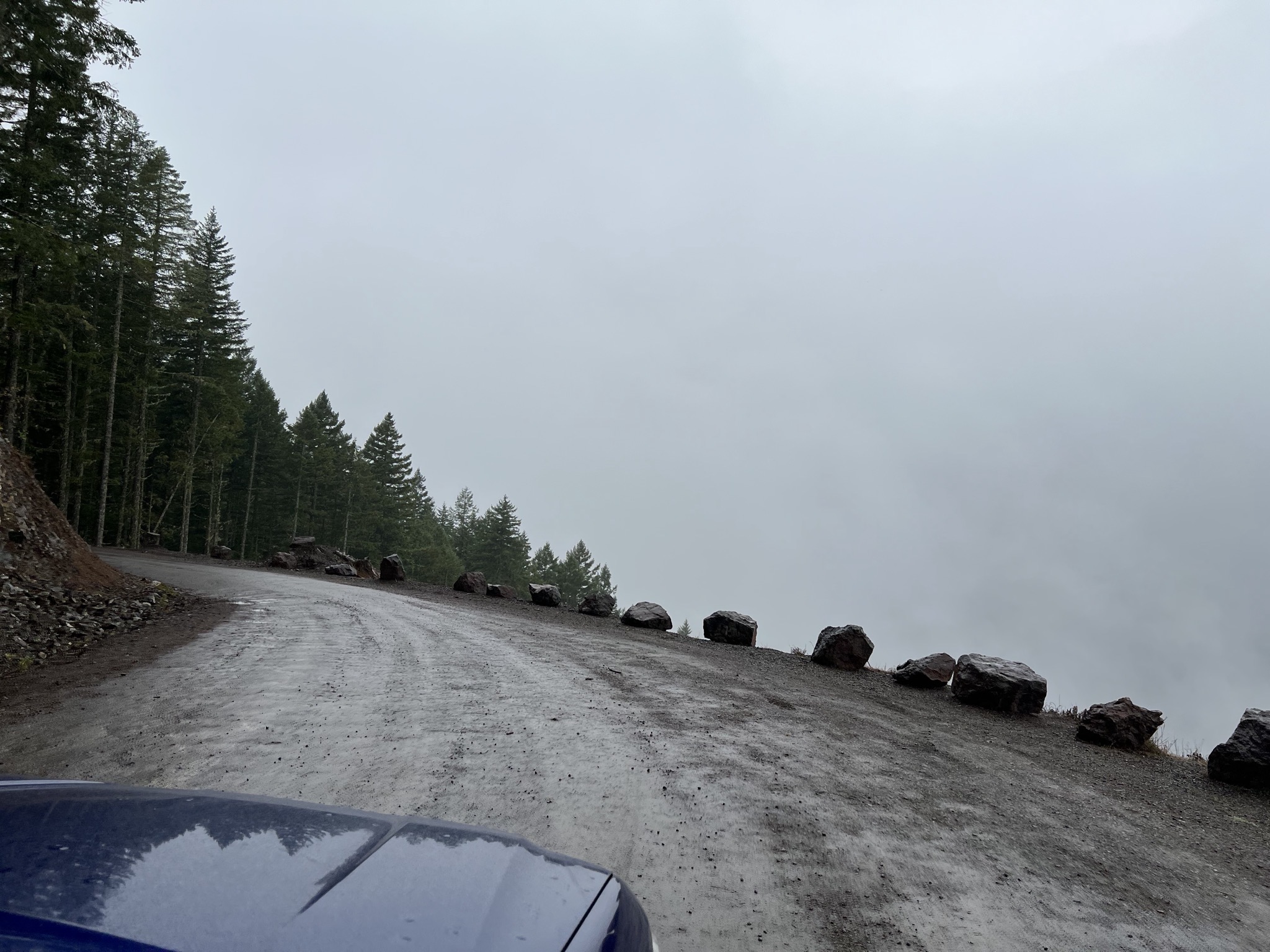 clouds next to dirt road