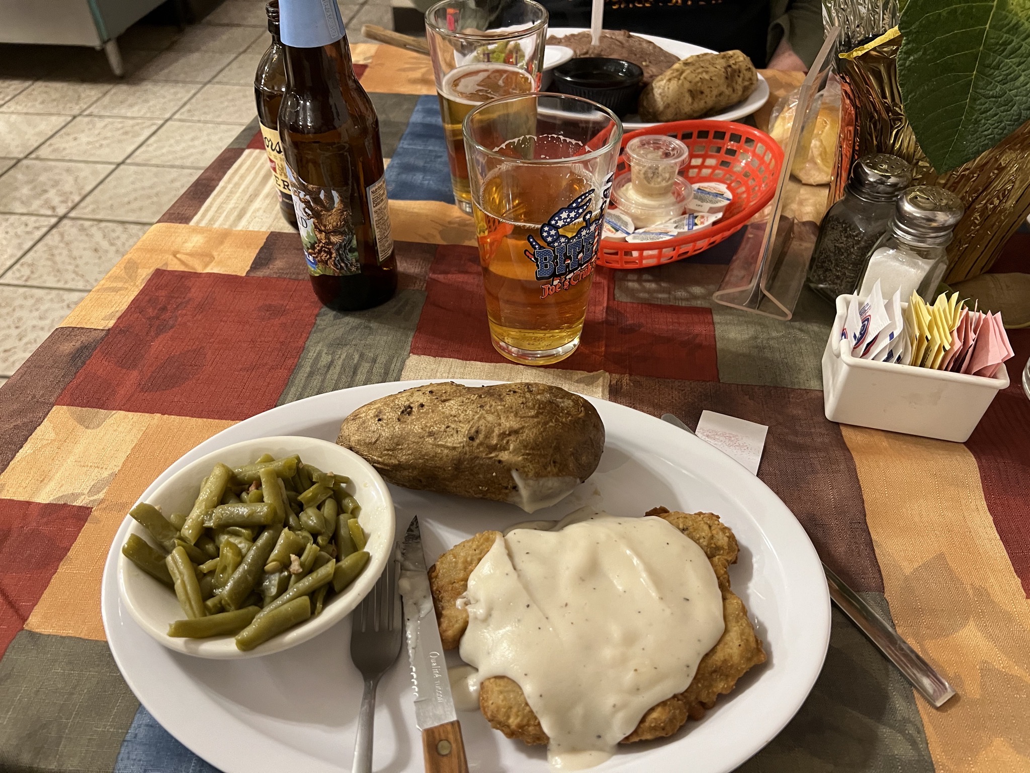 Chicken fried steak, baked spud, beans