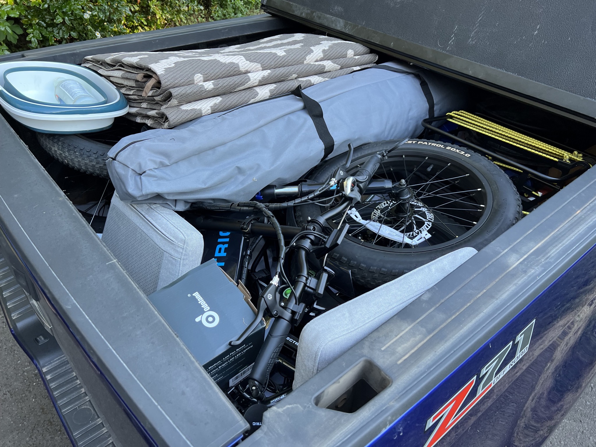 Two bikes and other stuff in truck bed