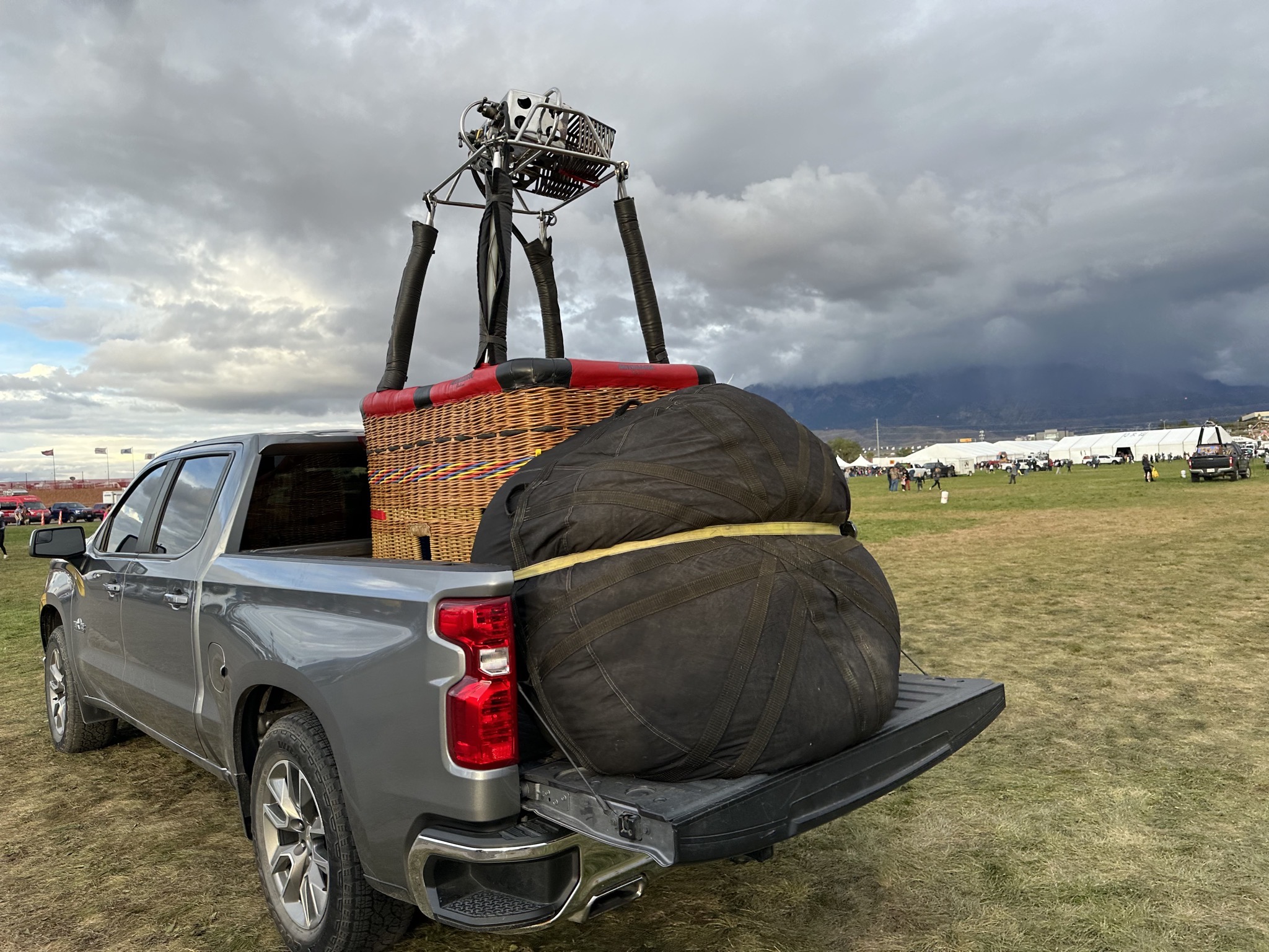 Balloon basket and envelope in back of truck
