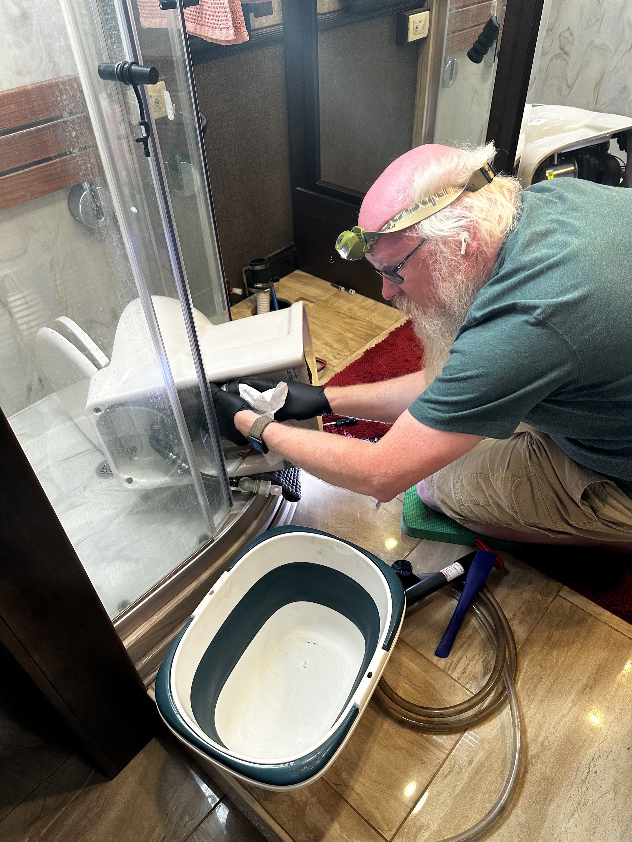 David cleaning out toilet