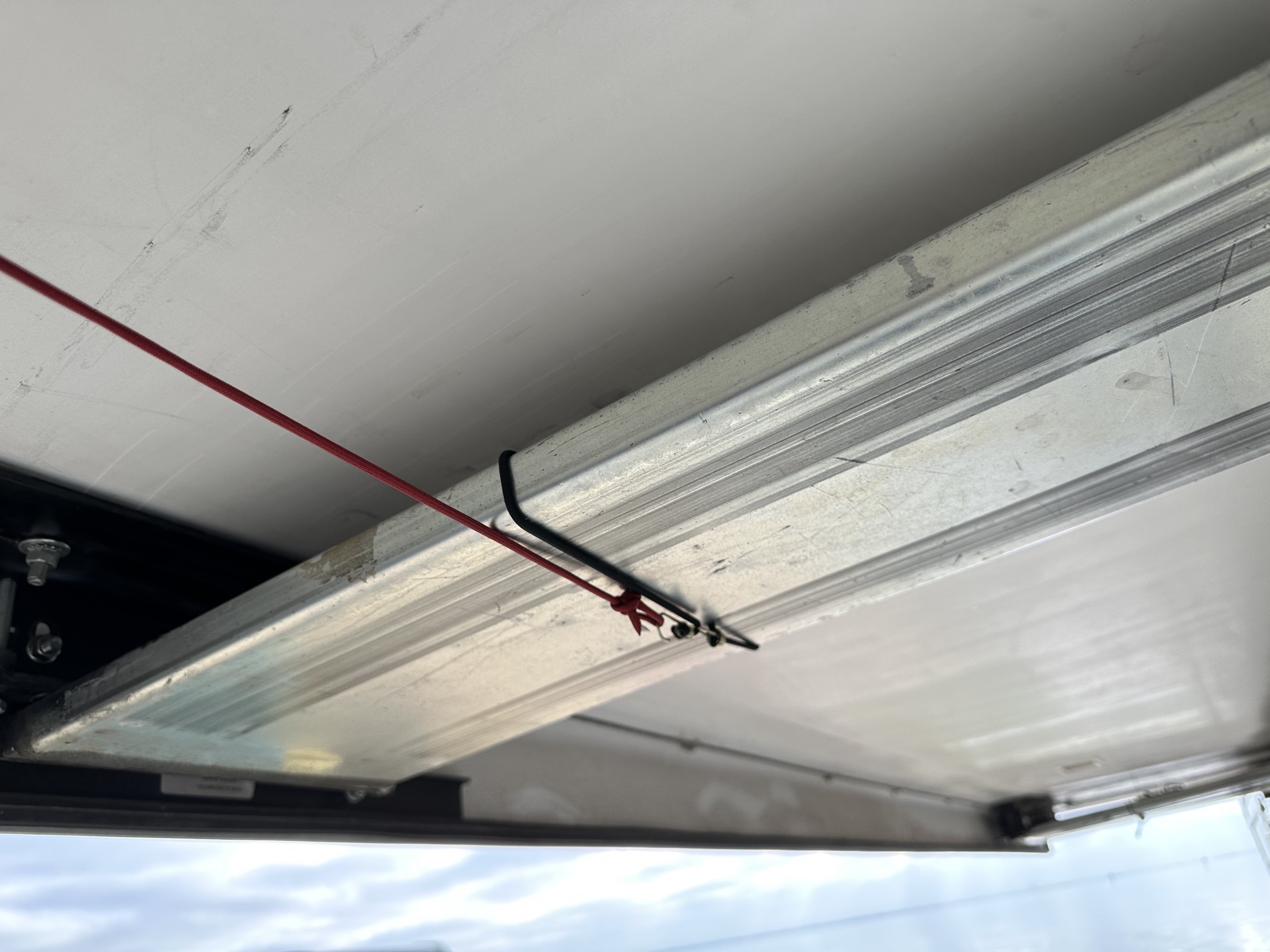Cord attached to slide via bungees
