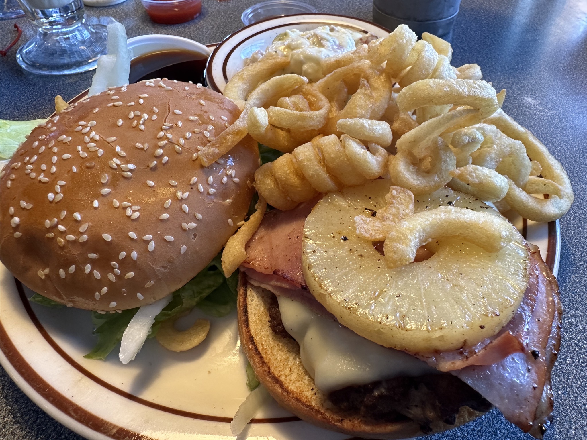 My Hawaiian burger and curly fries