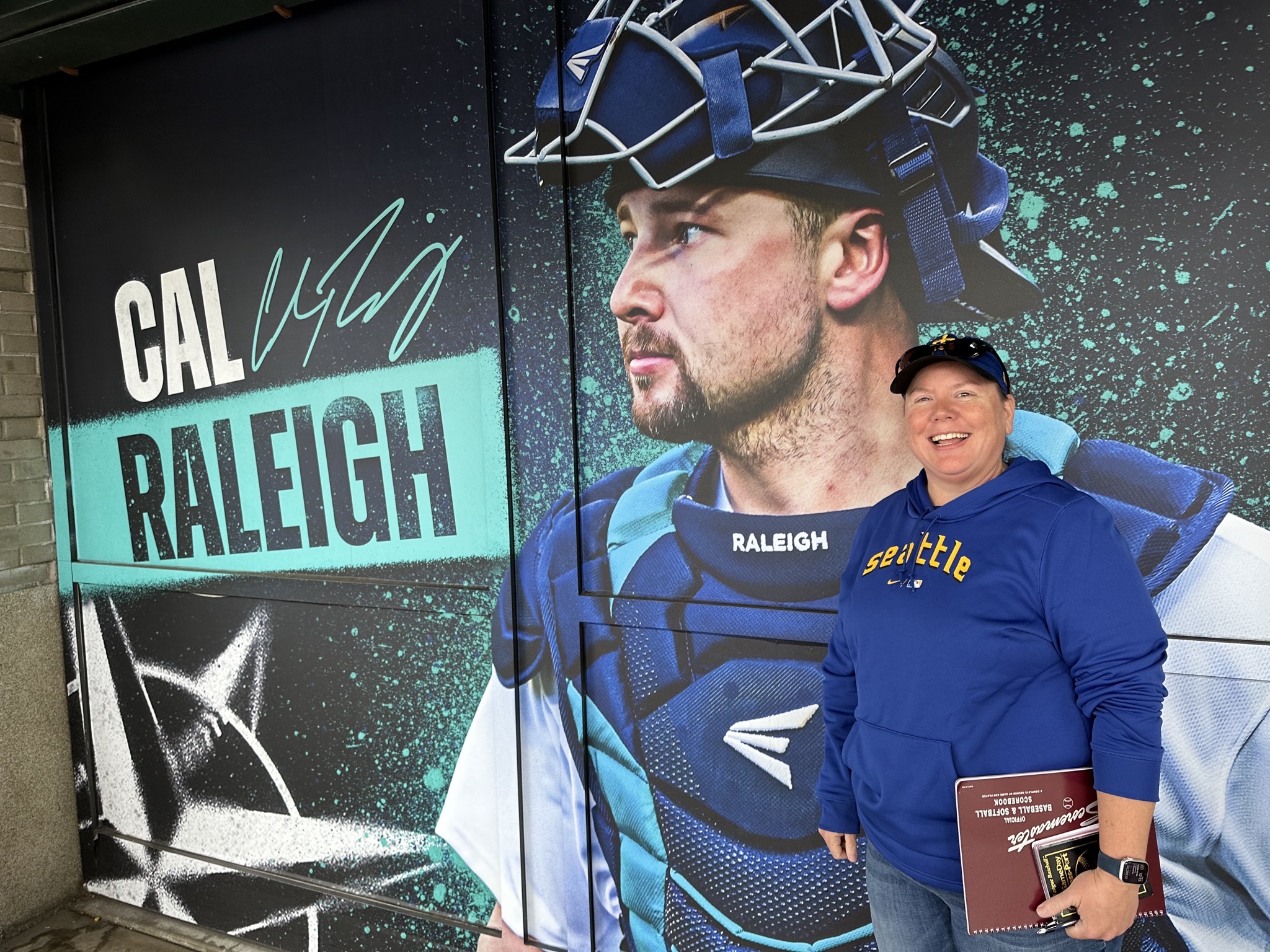 Jenn with a picture of her hero, Cal Raleigh