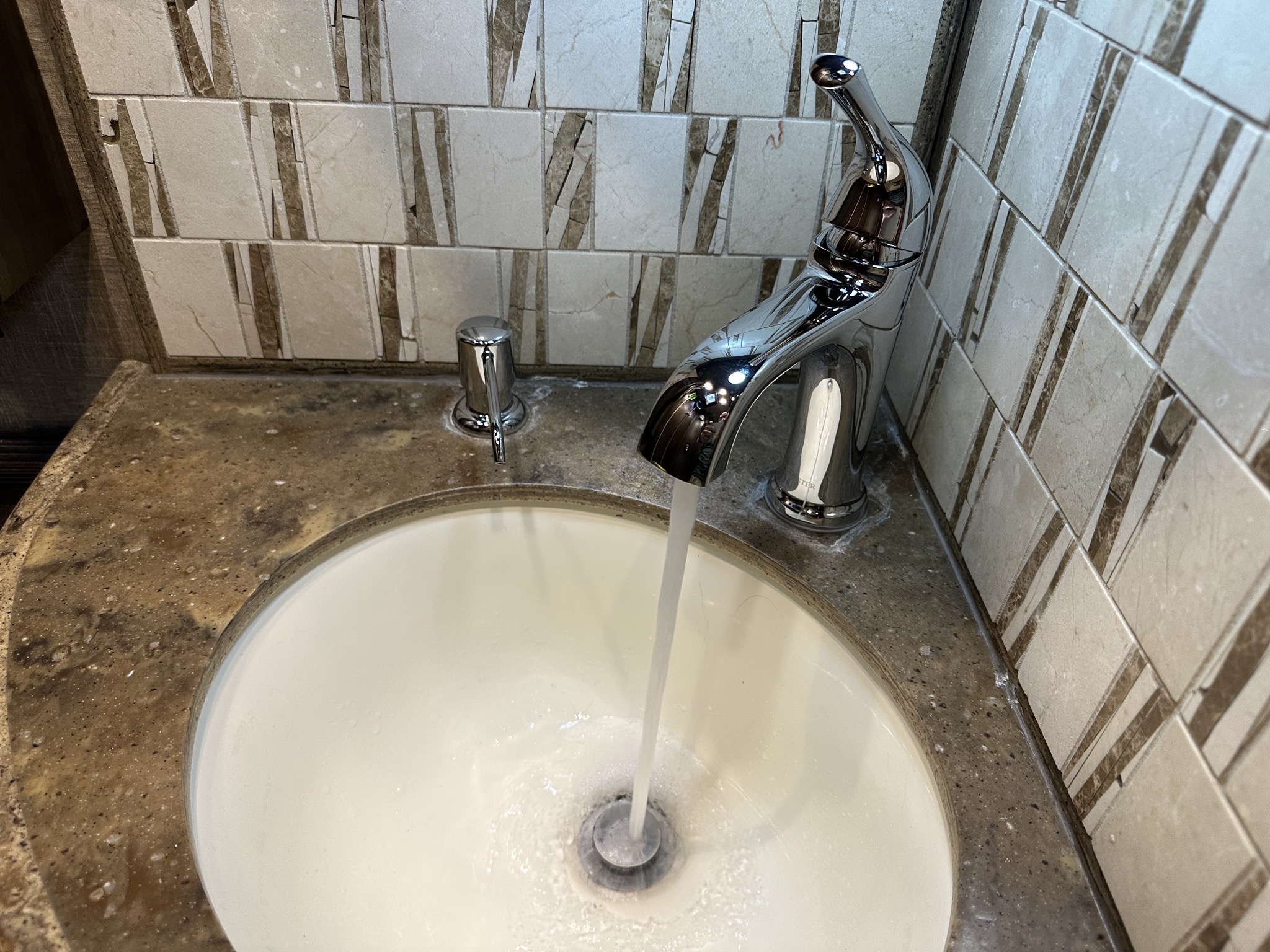 New soap dispenser and faucet in half bath