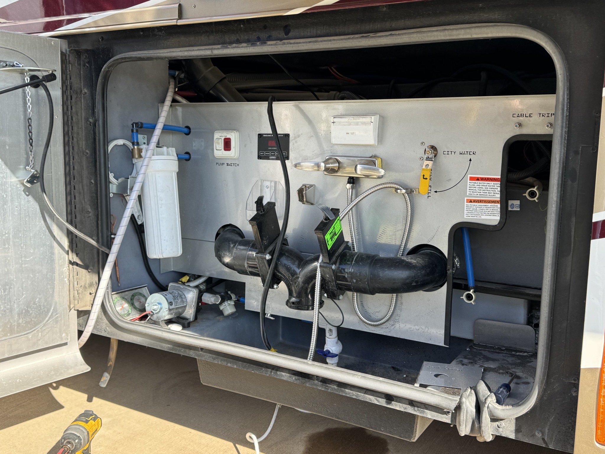 Removed panels and hose reel