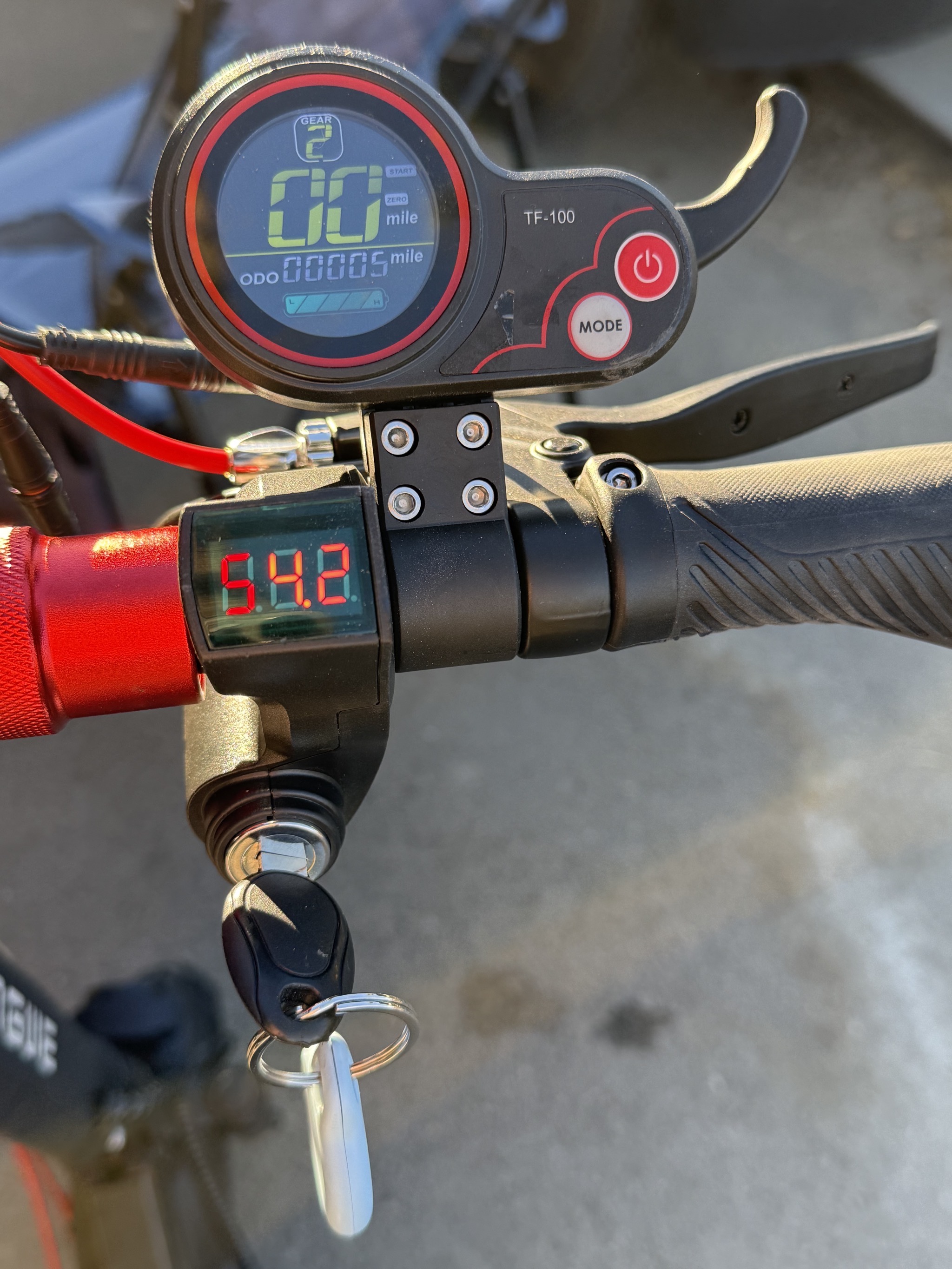 Display with gear, speed, odometer (or other displays, and battery level, and lever to accellerate; a second display with the battery voltage and key