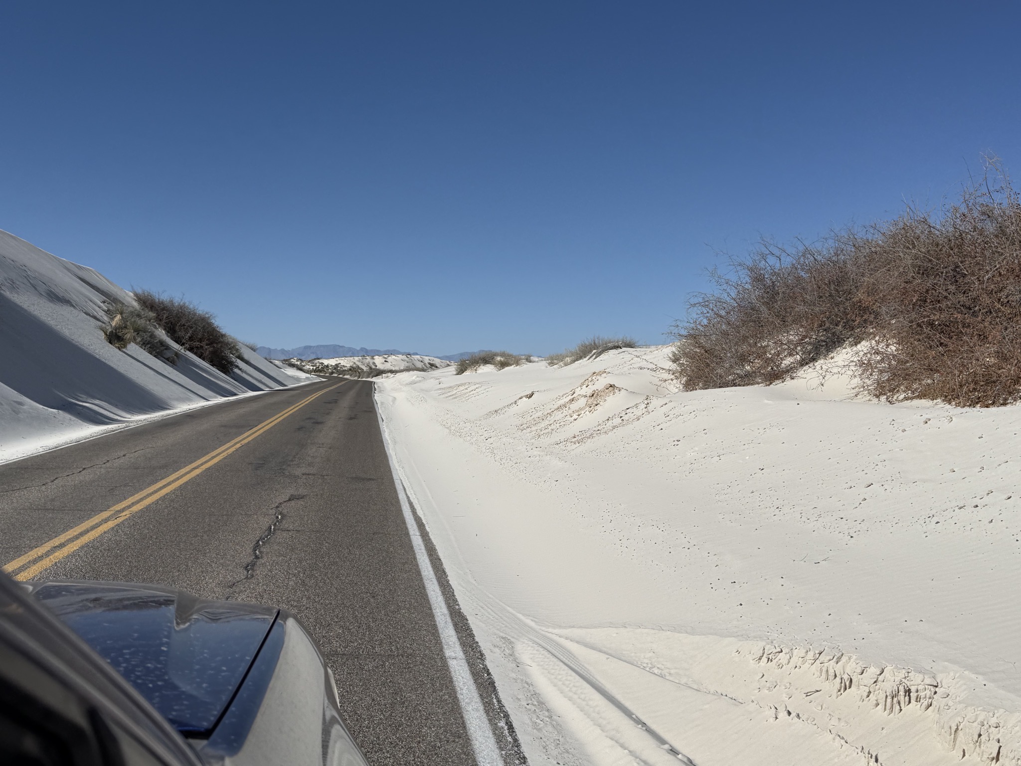 Road between sand dunes