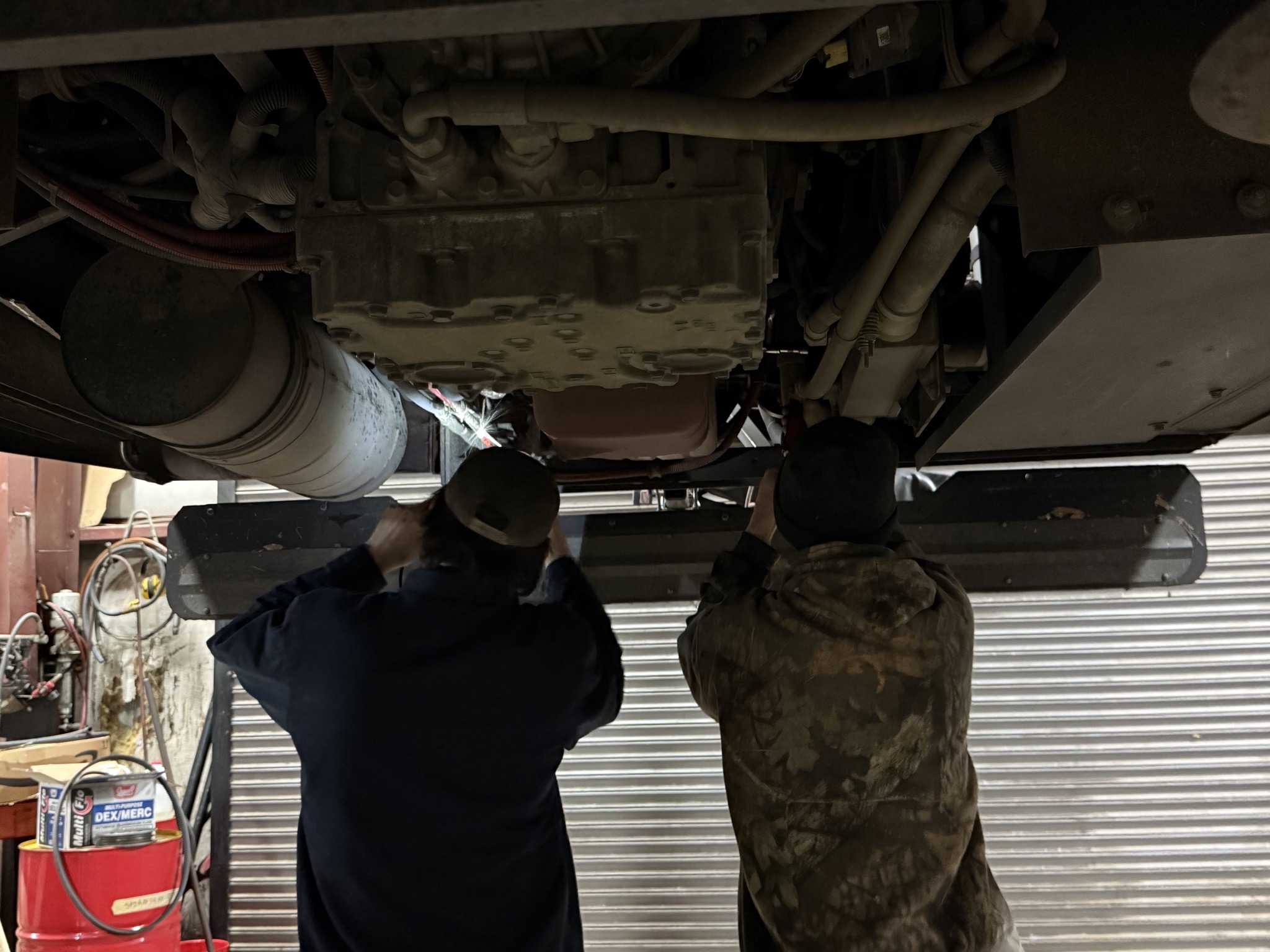 A couple of techs inspecting the engine