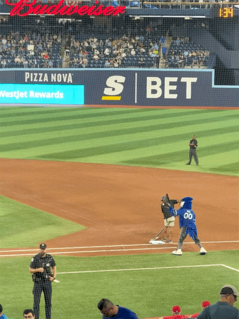 Mascot helping grounds crew