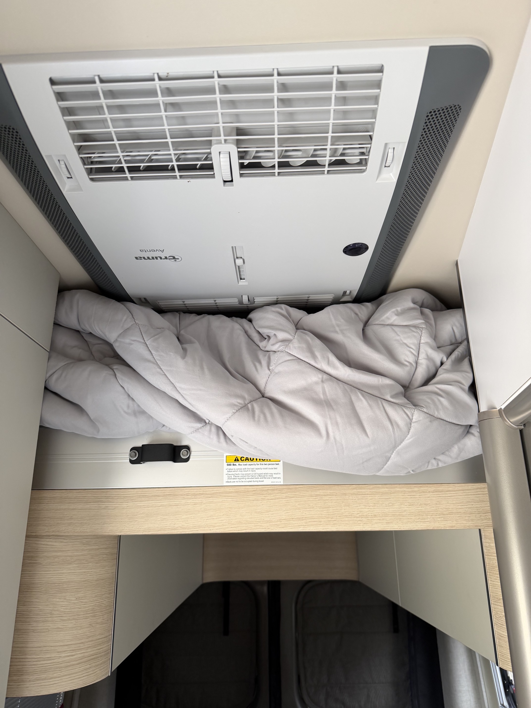 Ceiling AC and lift bed, with storage underneath