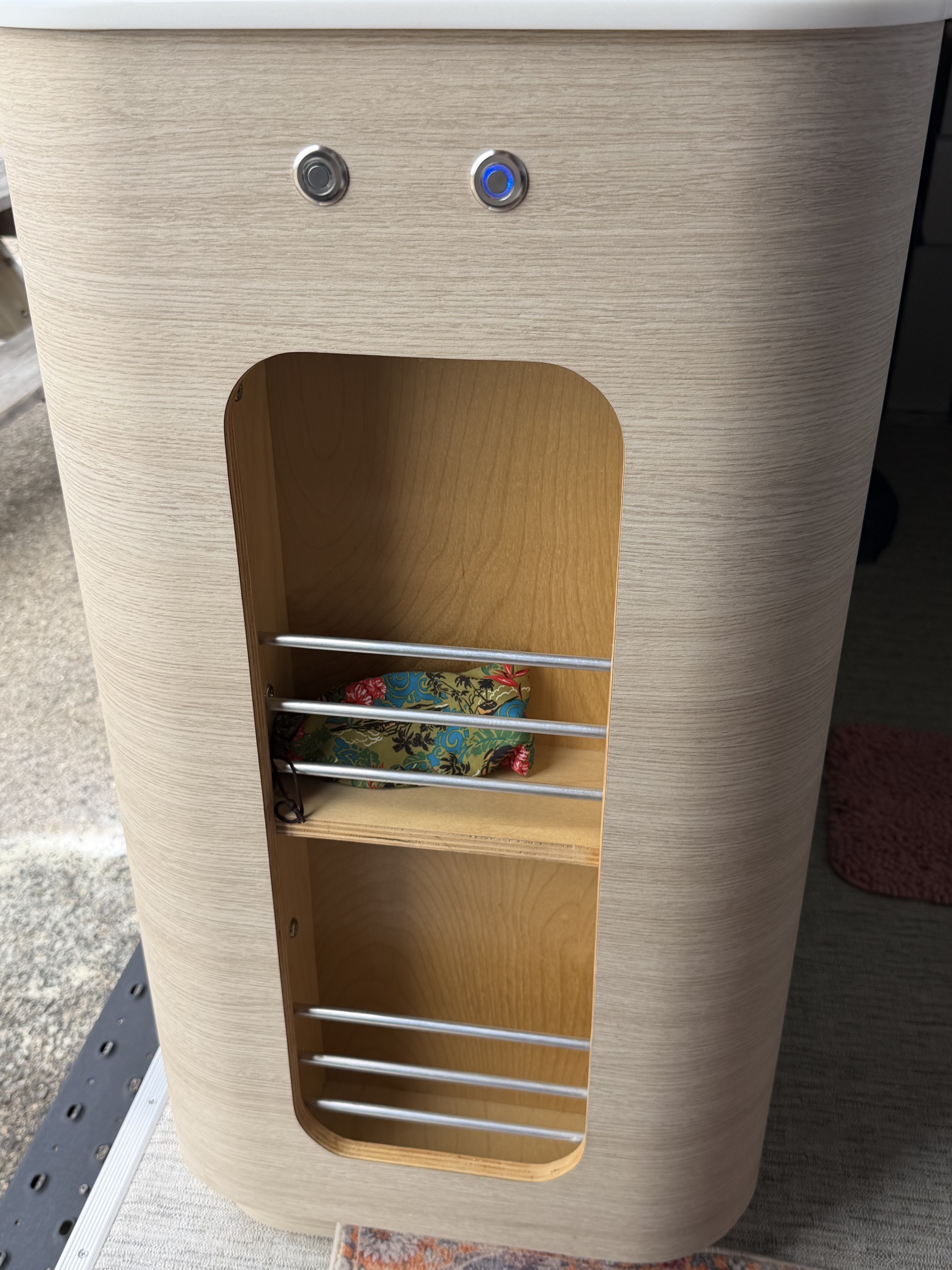 Cubbies next to the sliding door, with light switches