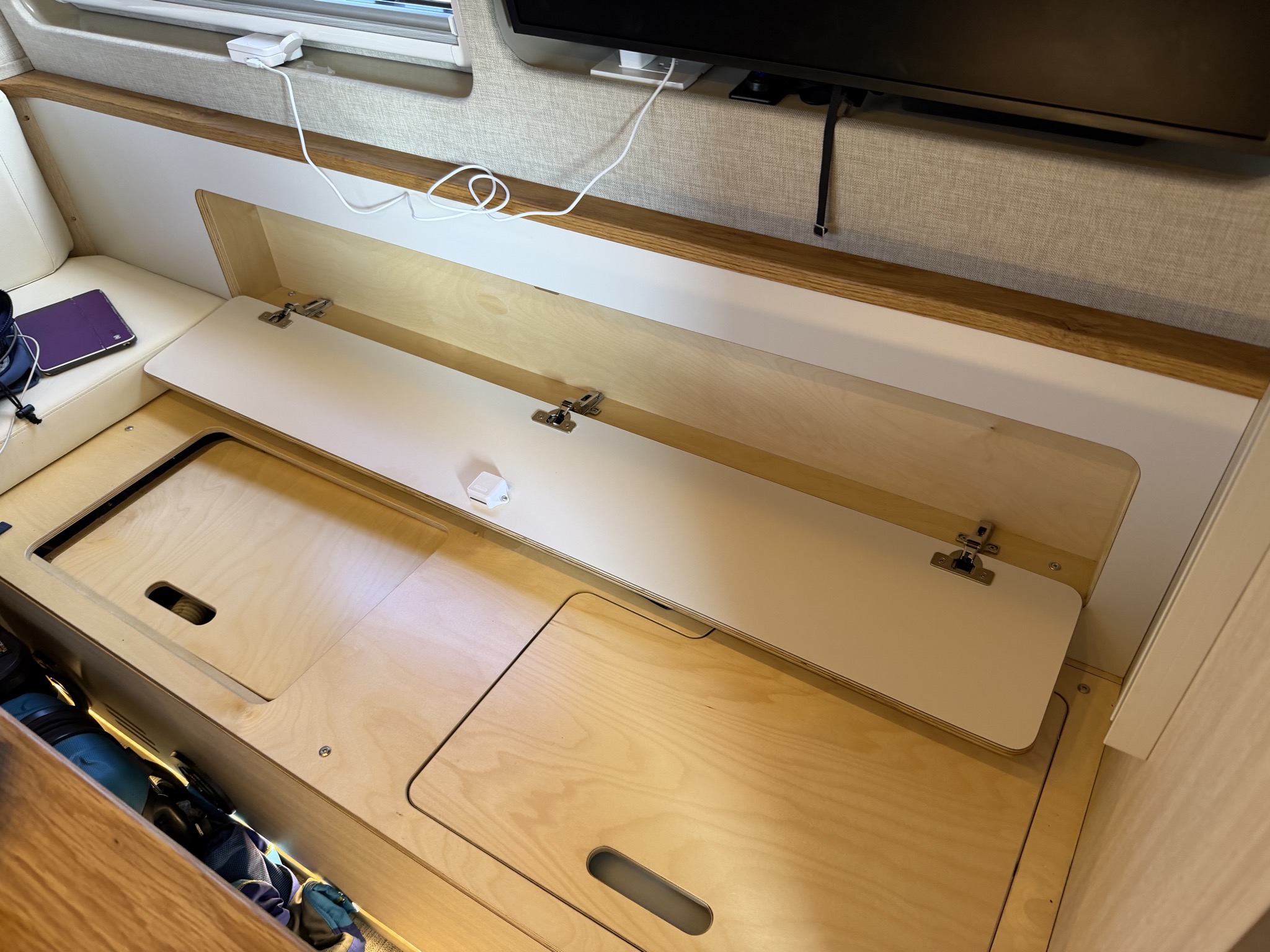 Storage behind seat back