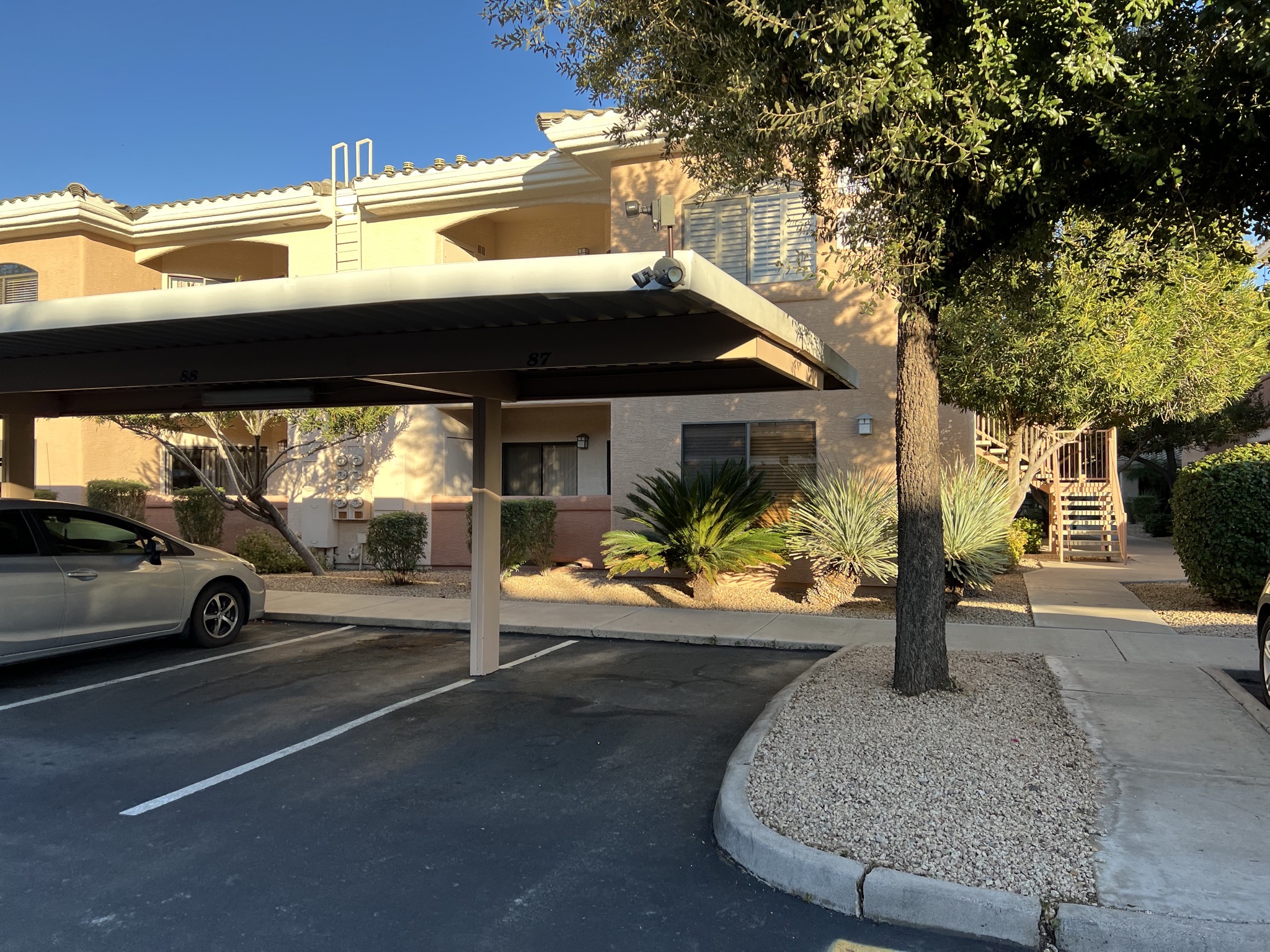 Carport and stairs to apartment