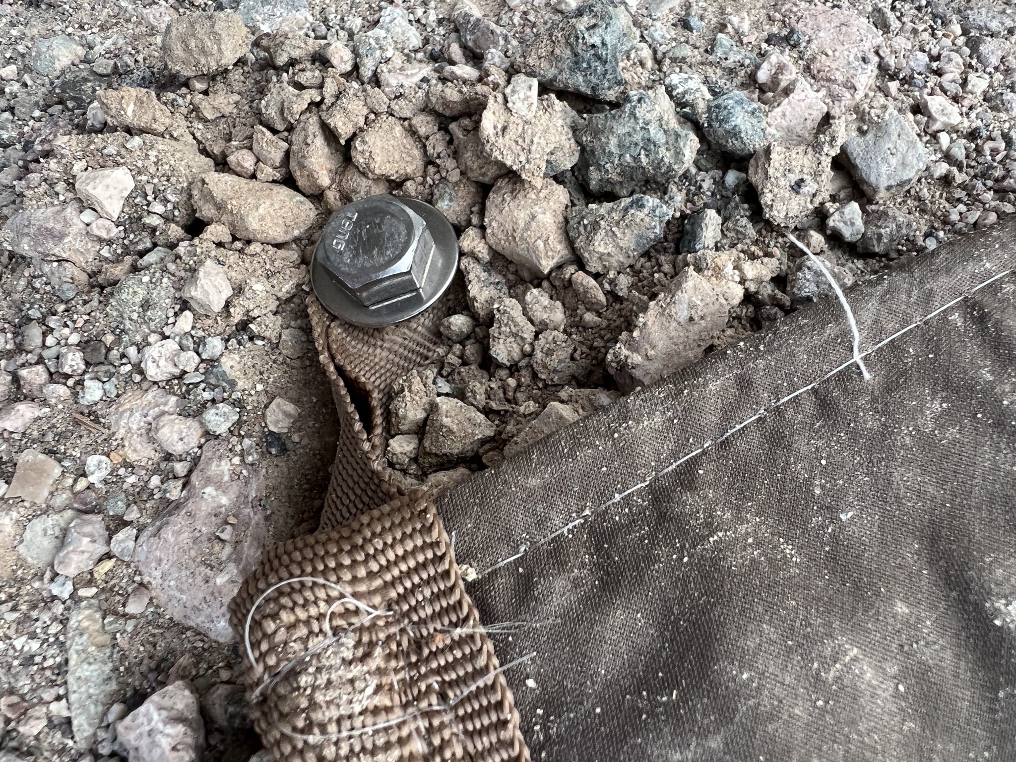 Bolt and washer securing mat
