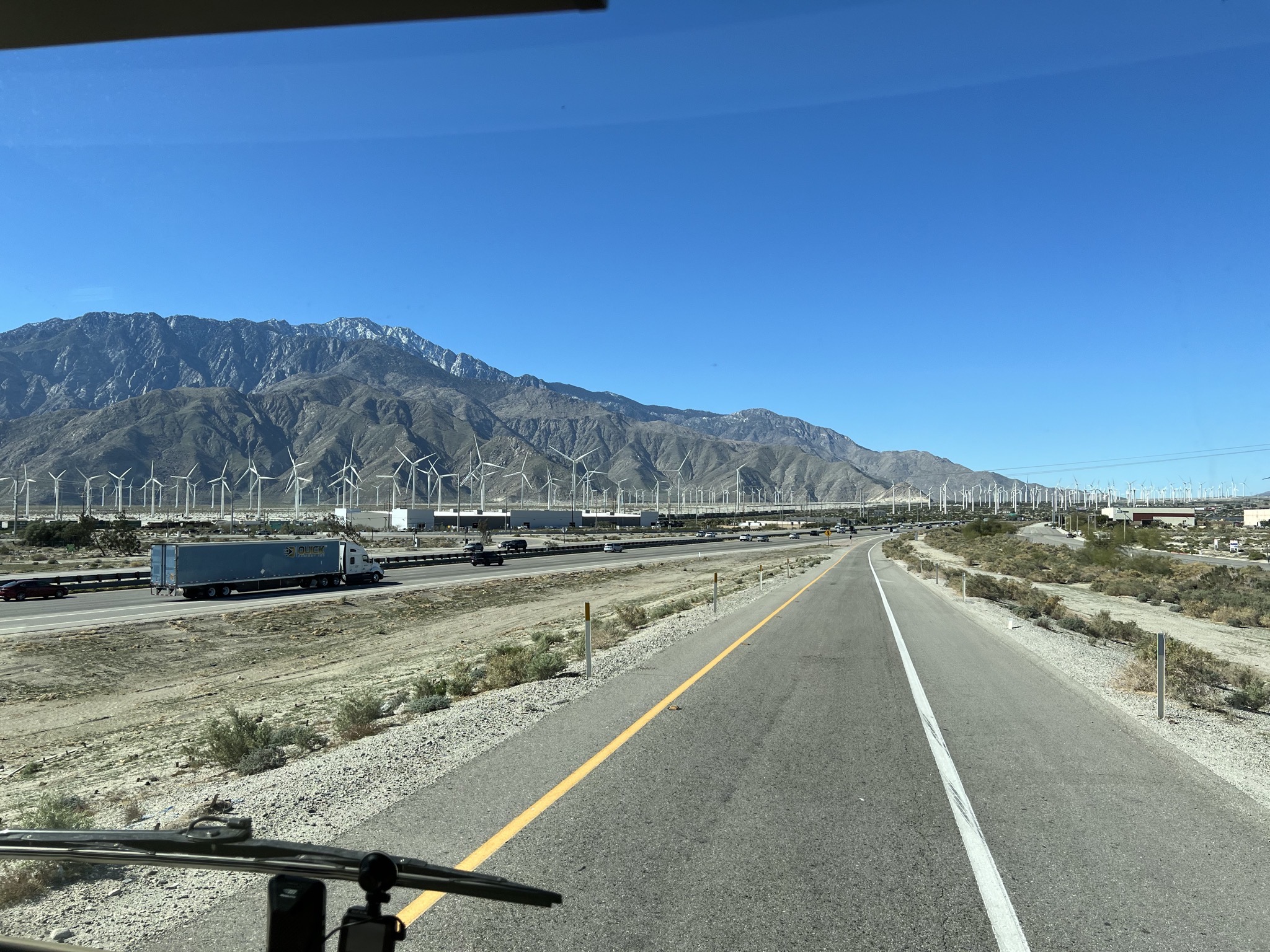 Mountain, wind turbines, freeway