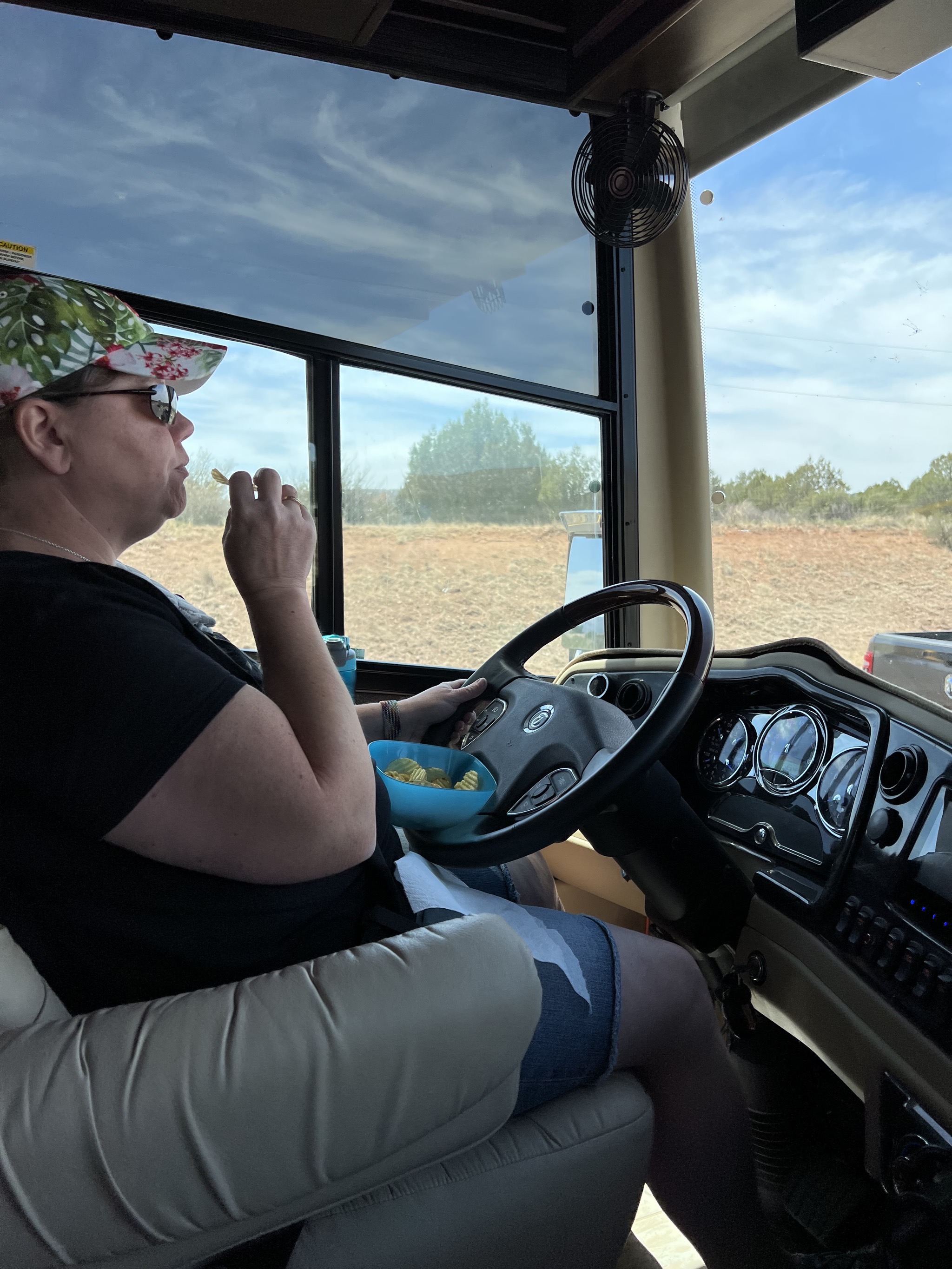 Jenn eating chips while driving