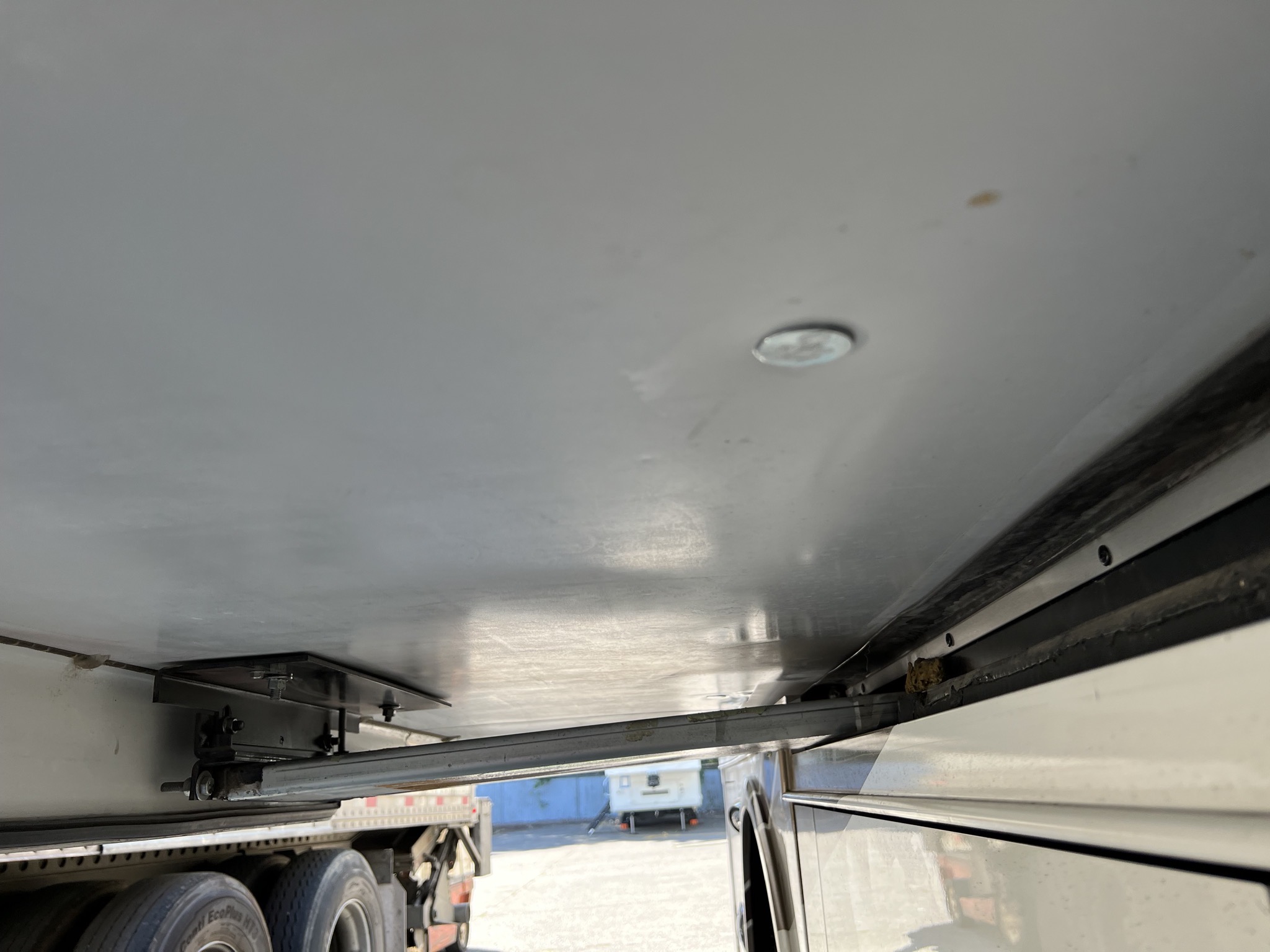 Bolt through underside of slide-out