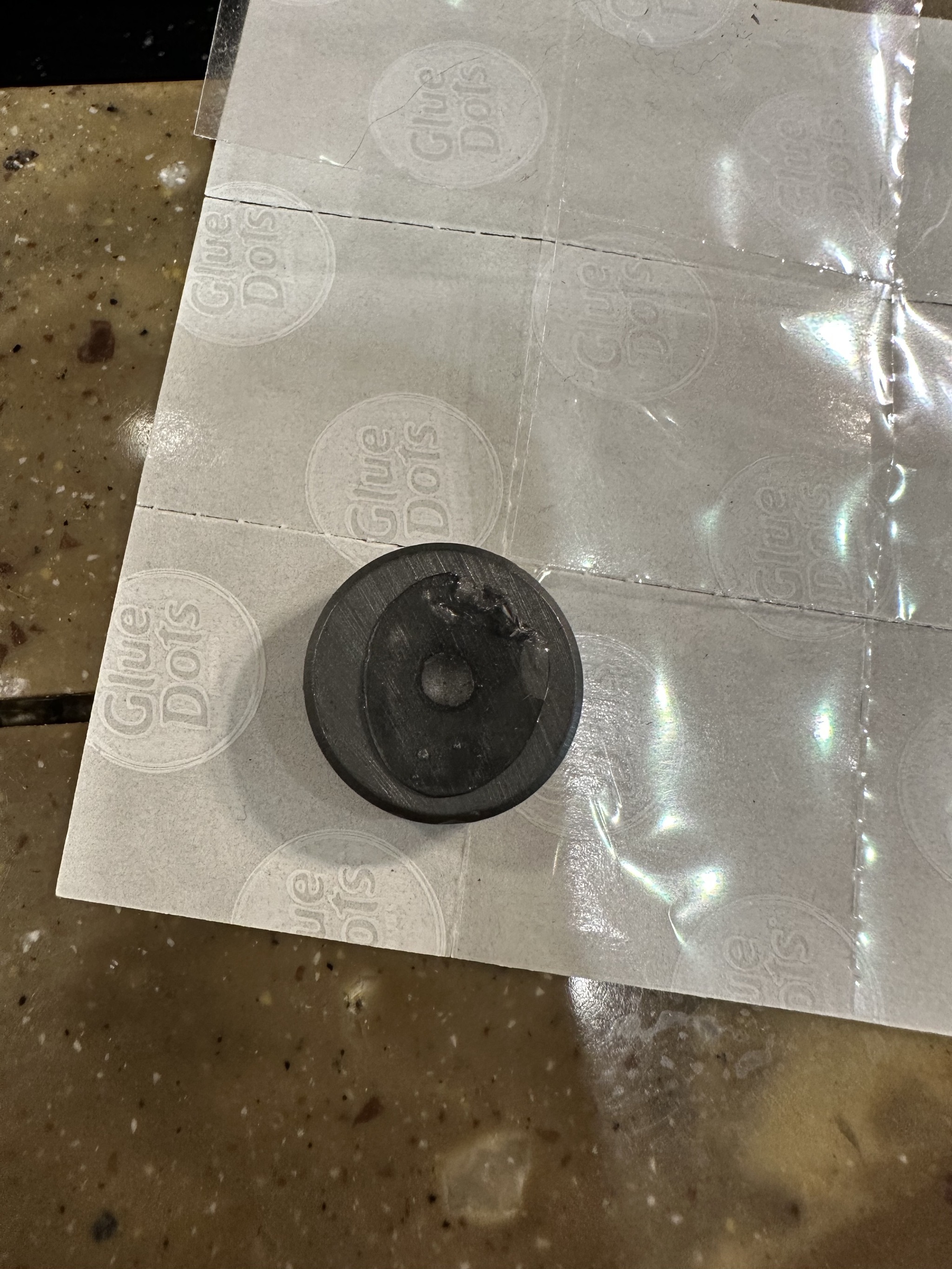 Glue dot on magnet