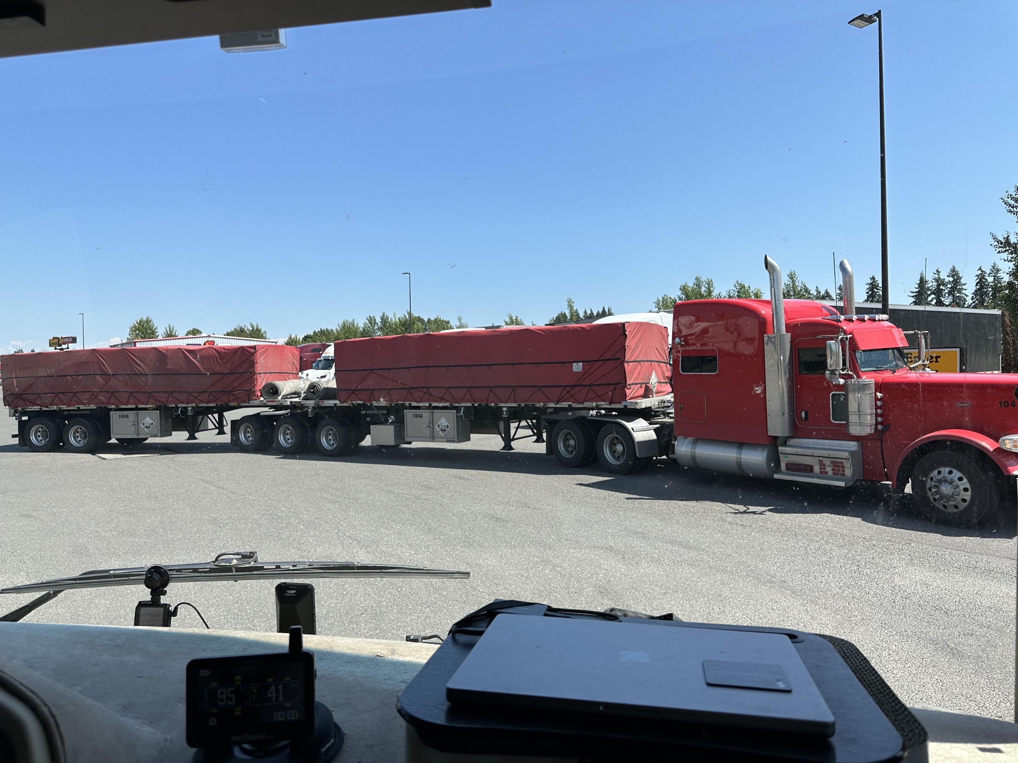 Extra long truck and trailers going out the entrance