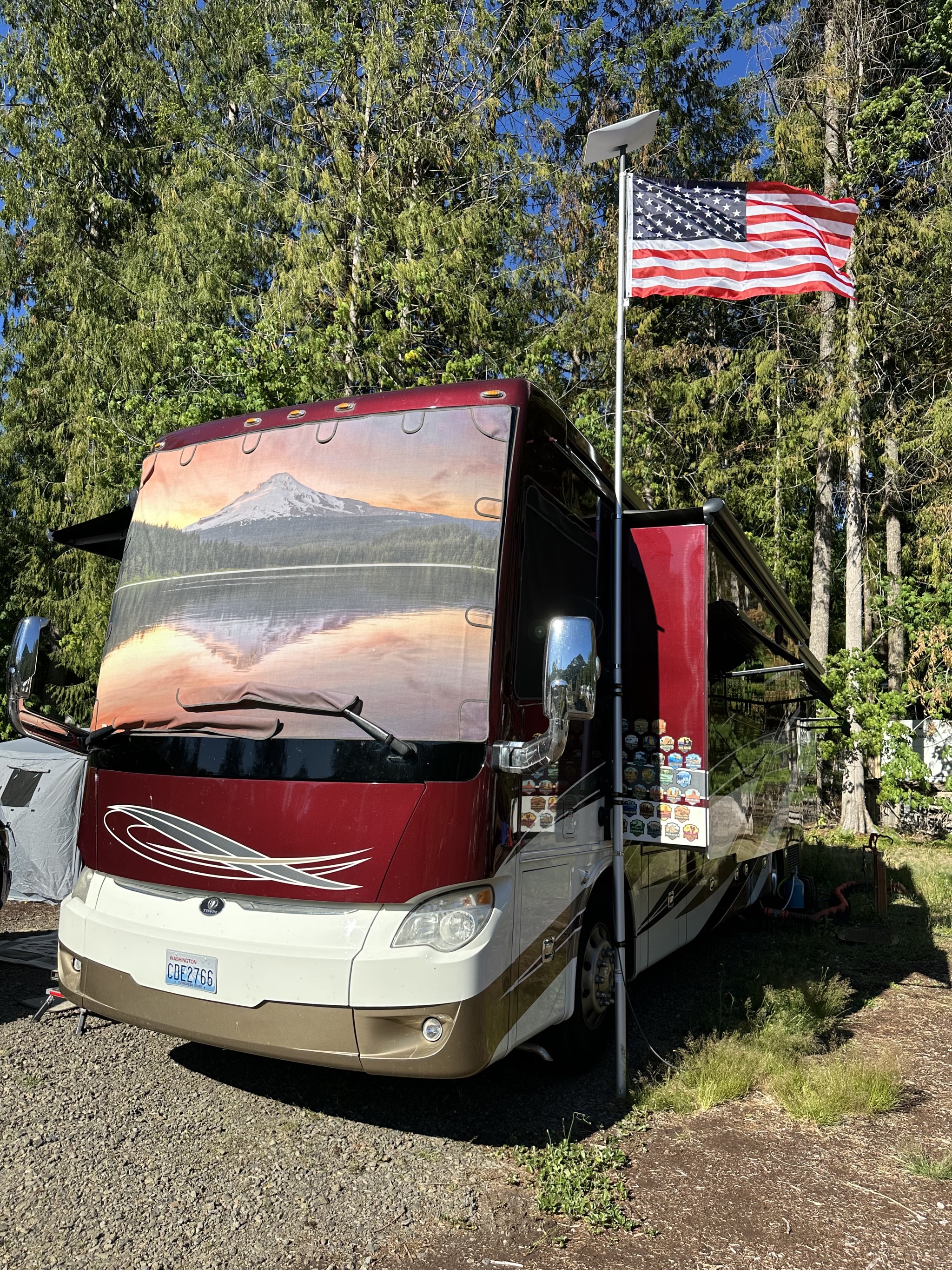 Flagpole with Starlink dish and US flag