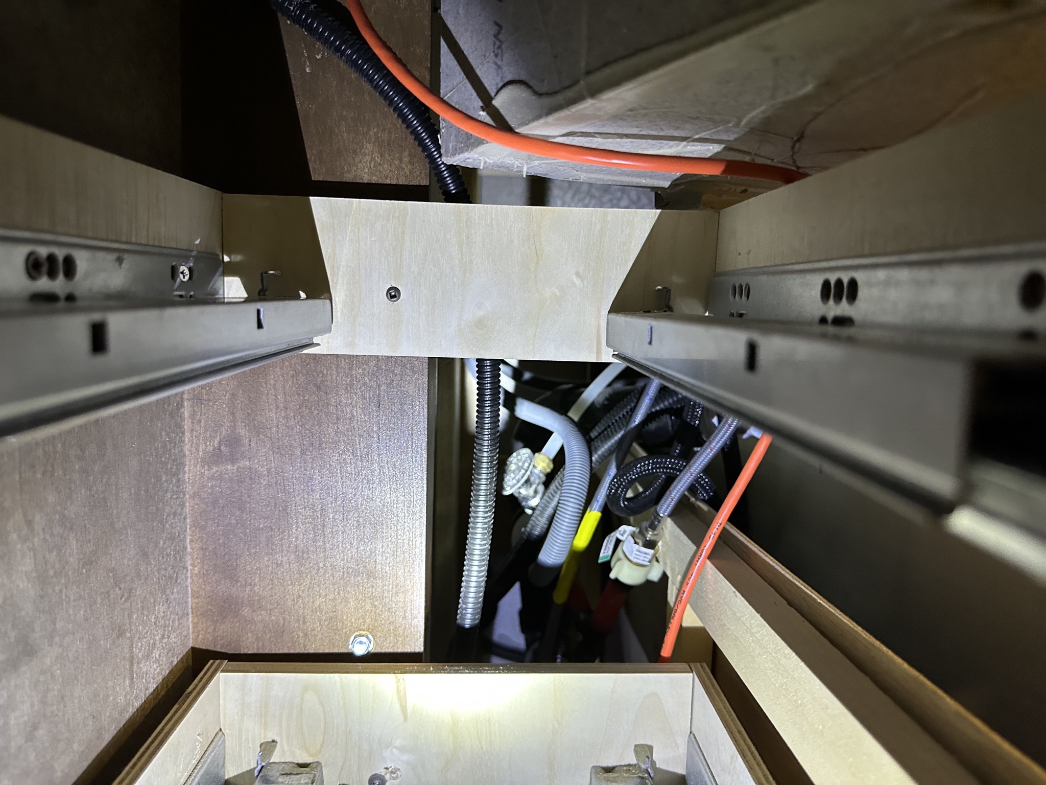 Behind kitchen drawers
