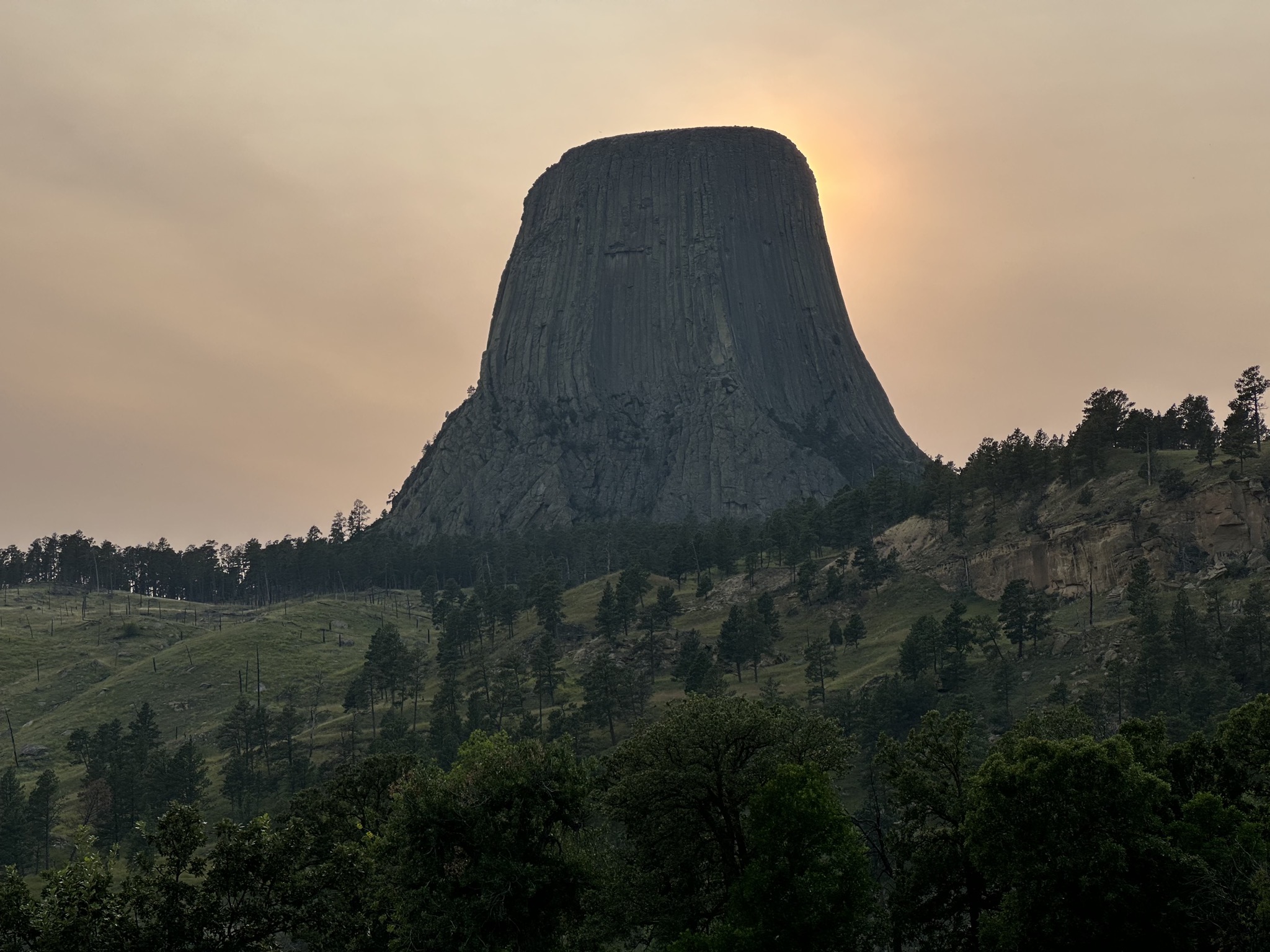 Sun setting behind Devils Tower