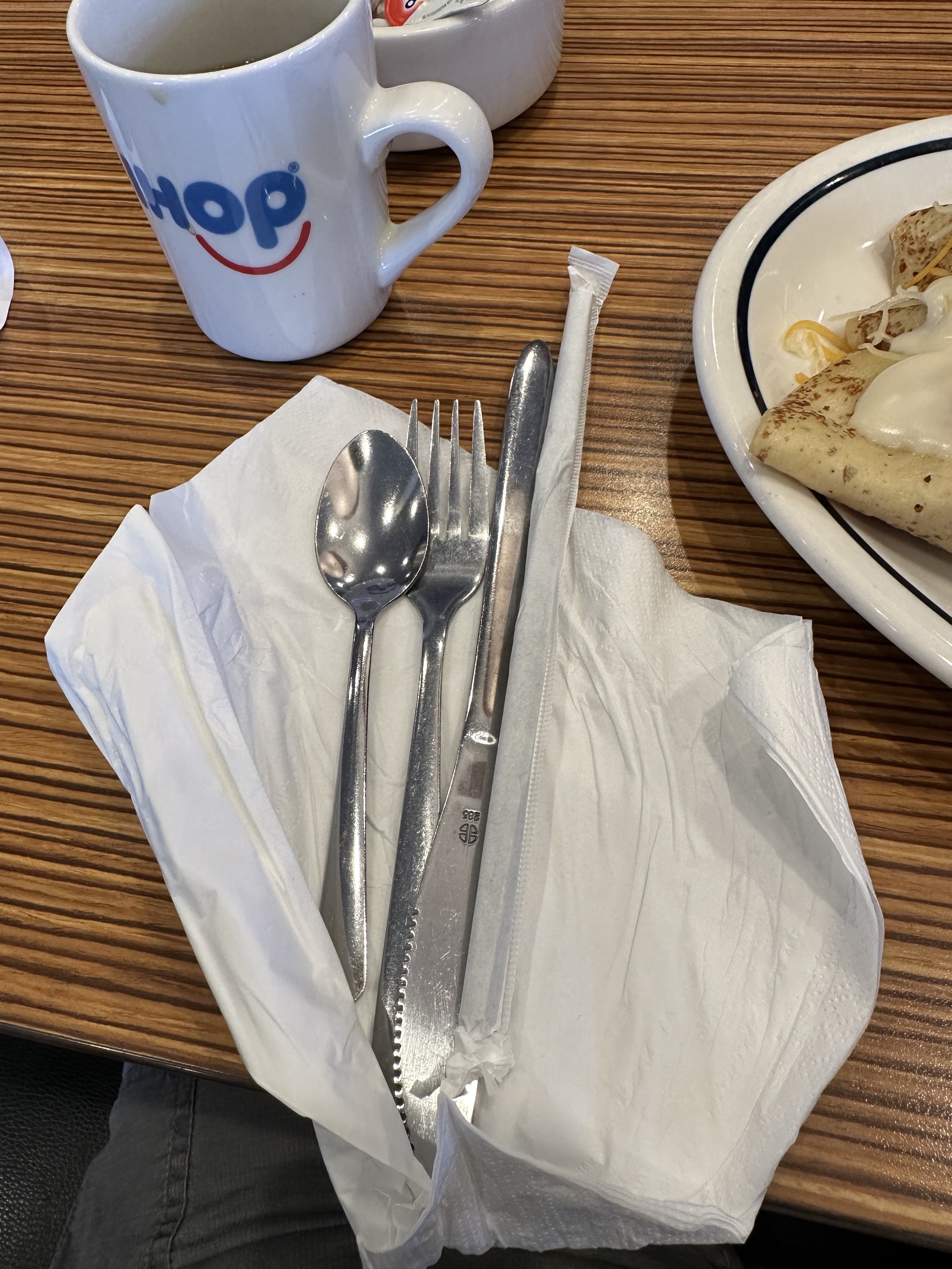 Straw with silverware and napkin