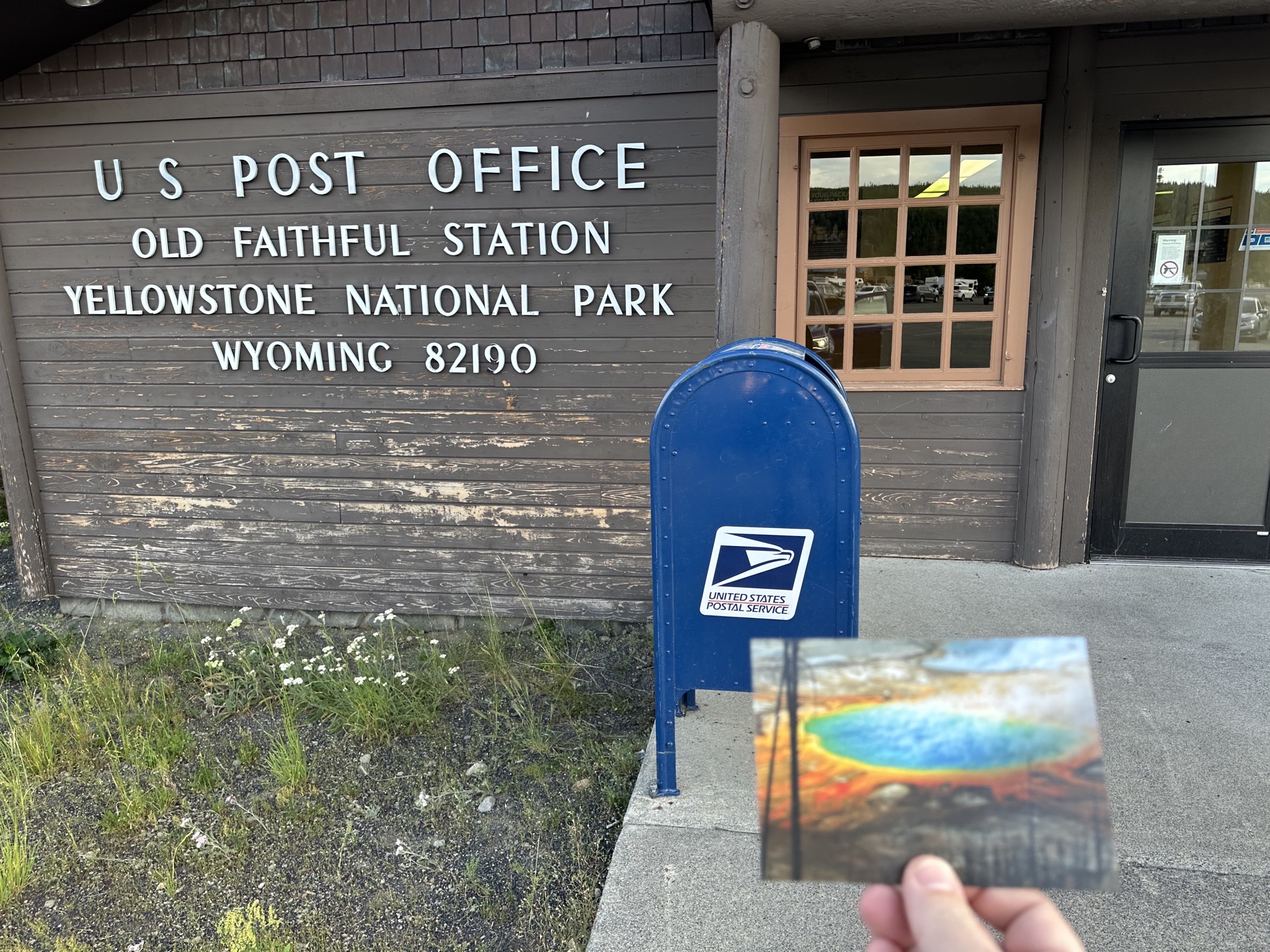 Old Faithful post office with Grand Prismatic Spring postcard