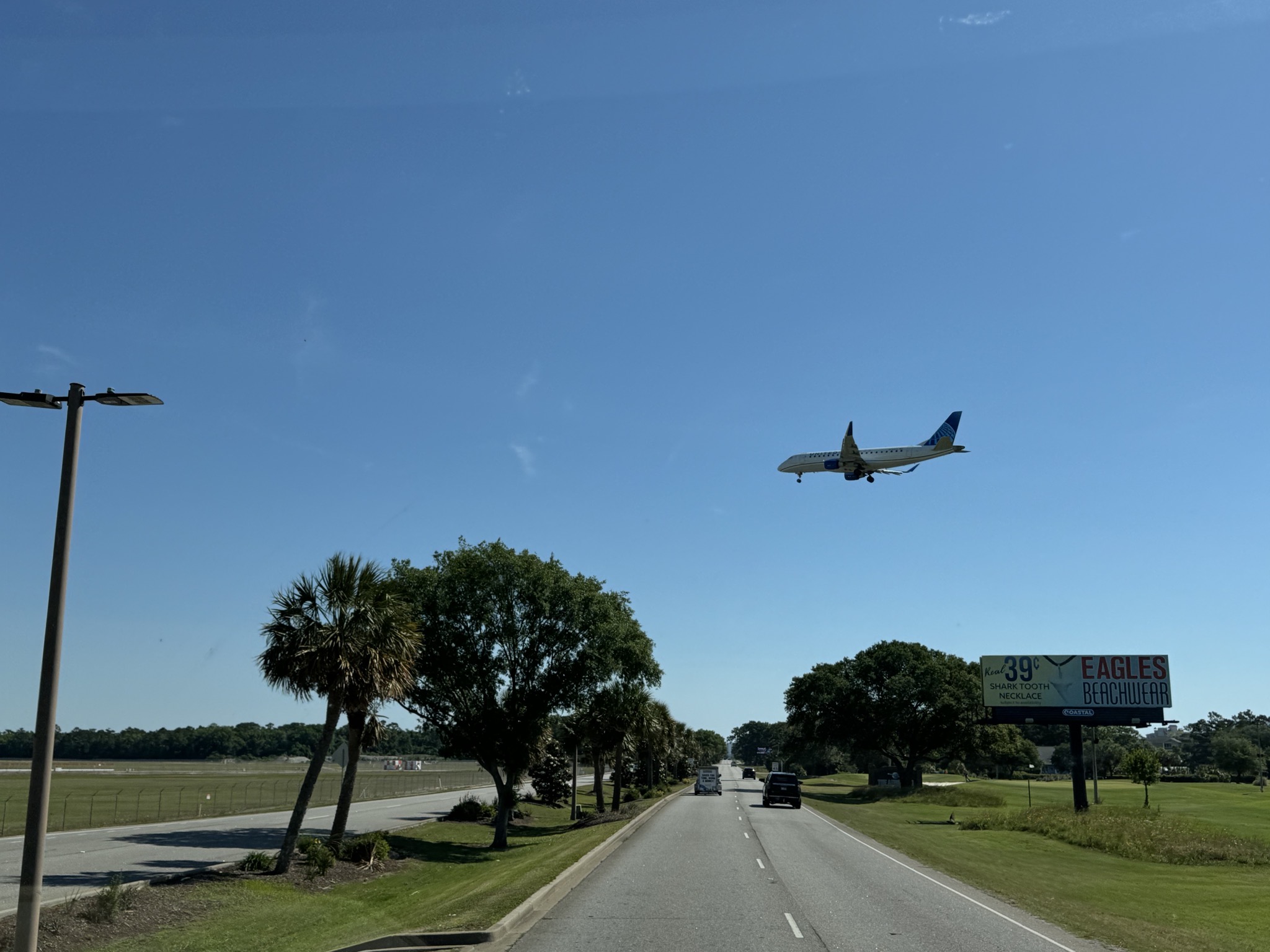 Plane flying low over highway