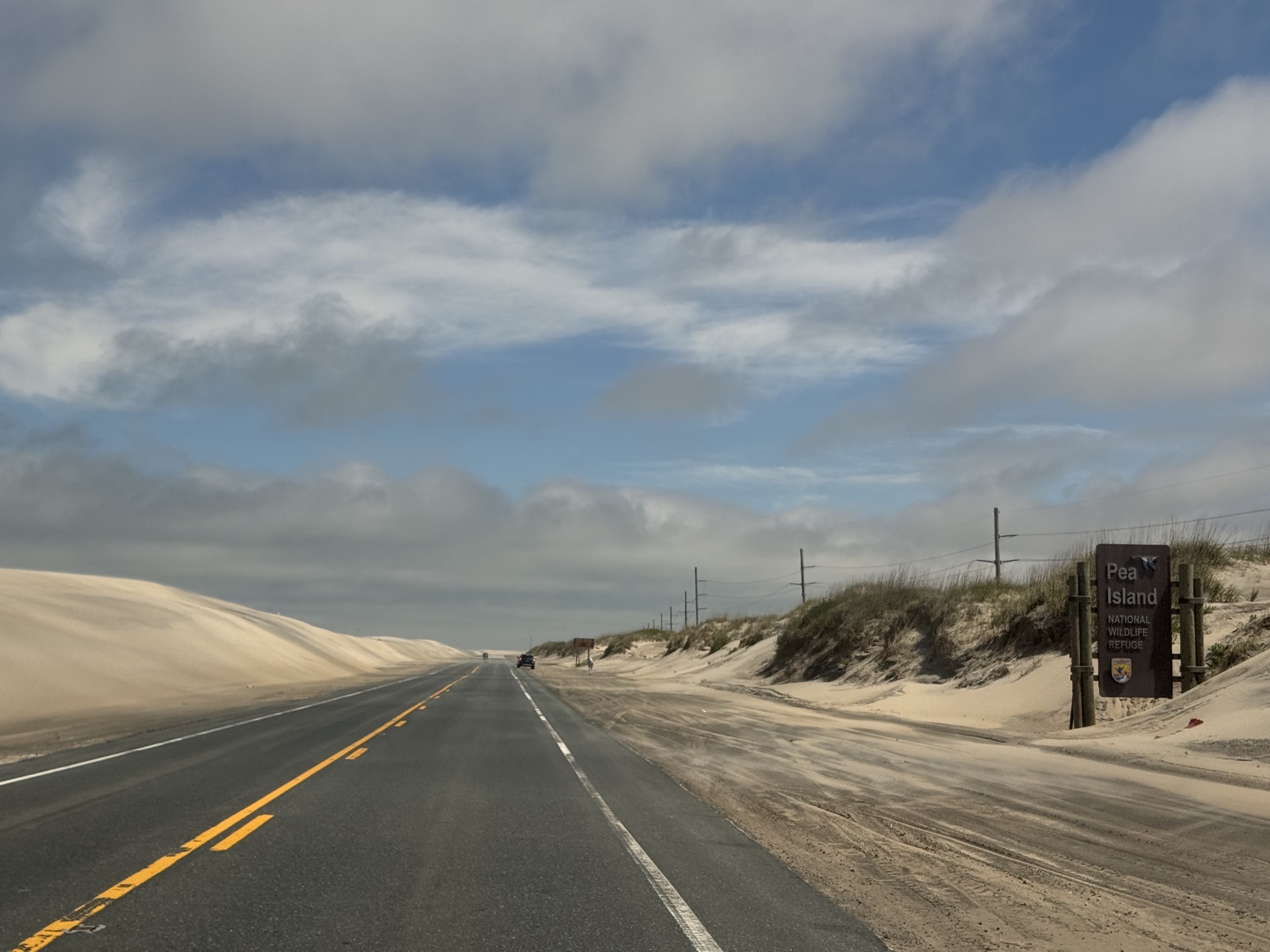 Sand blowing over the road