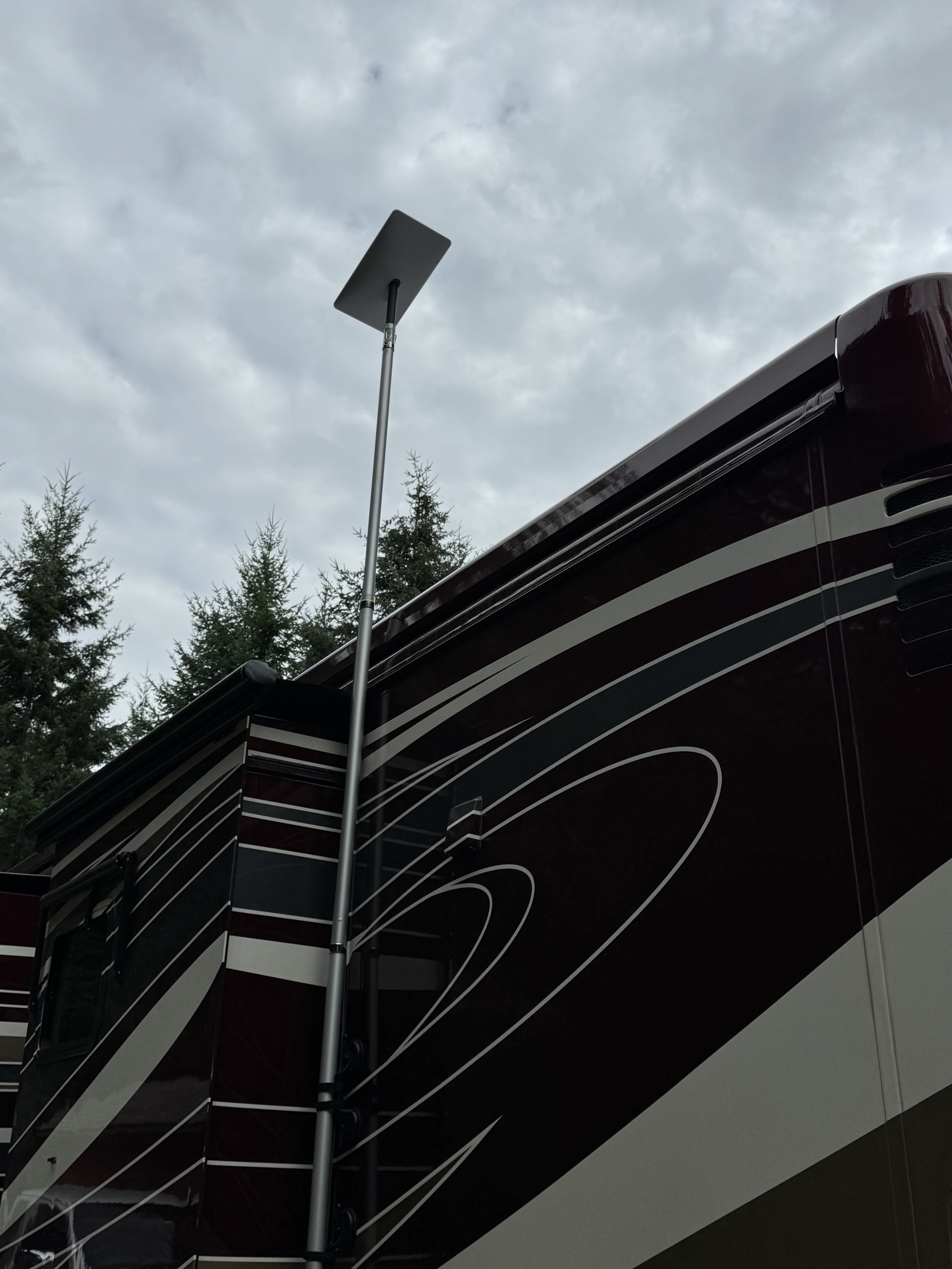 Starlink dish on flagpole