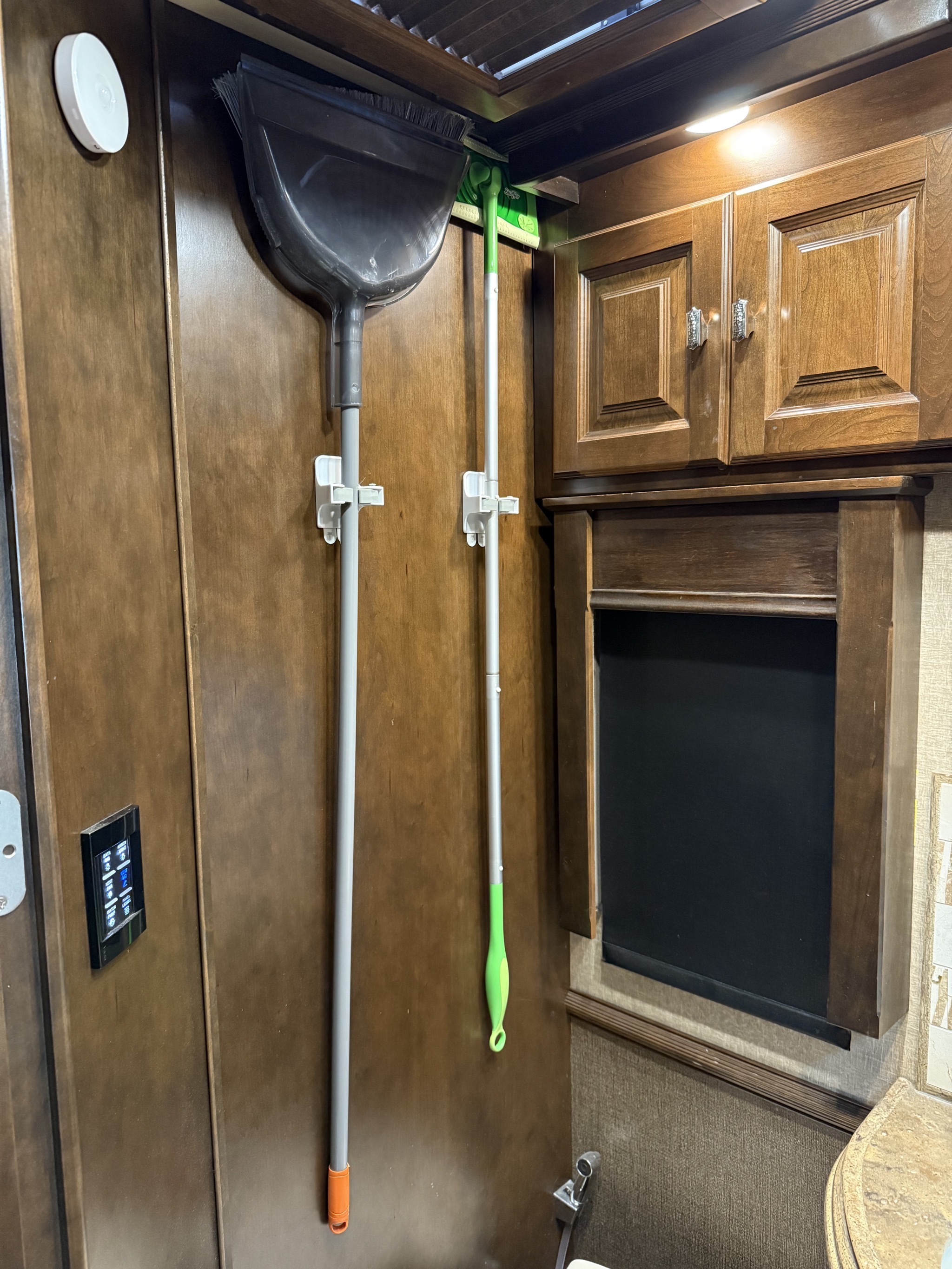 Broom and mop on wall