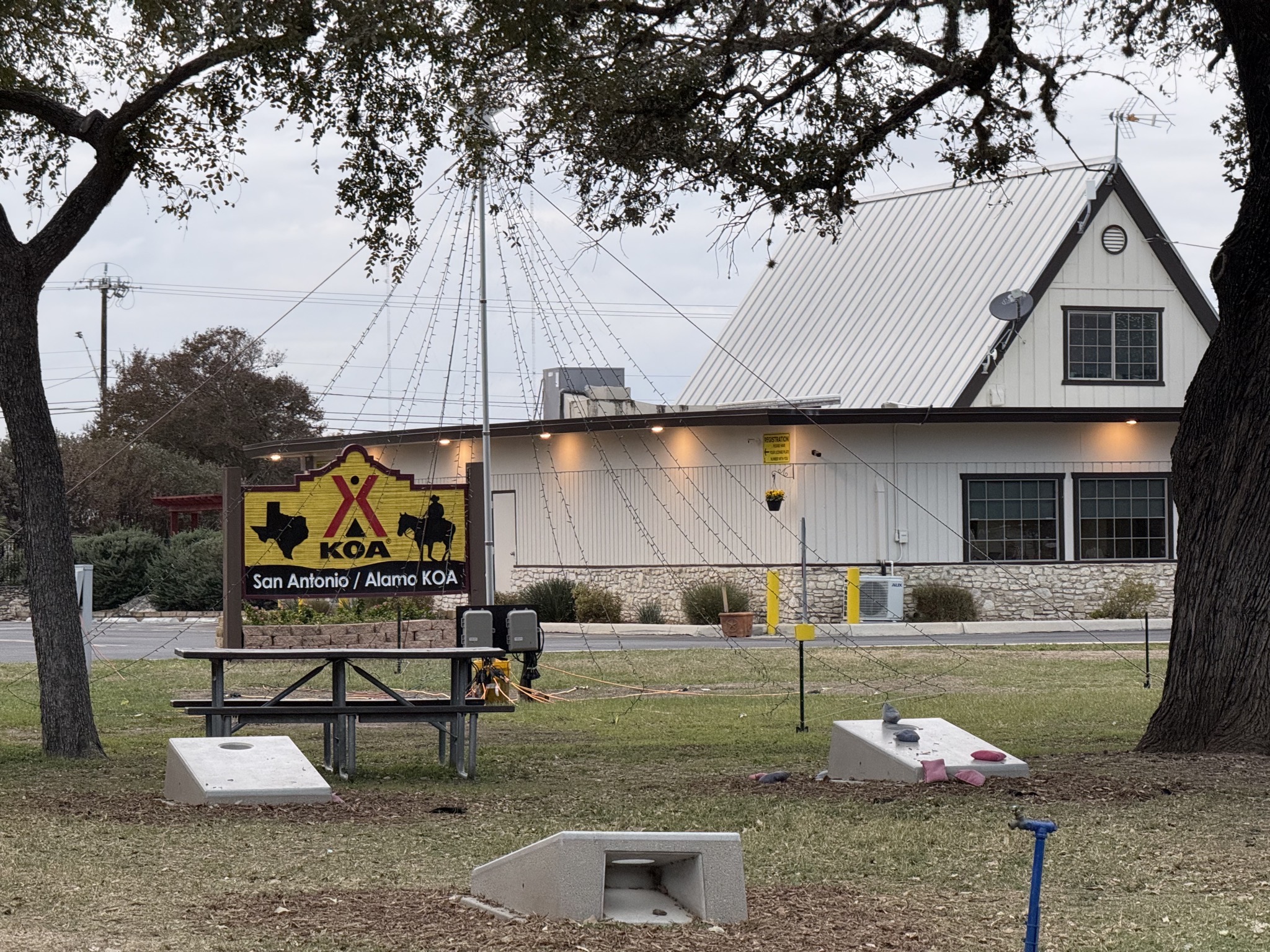Sign and concrete cornhole