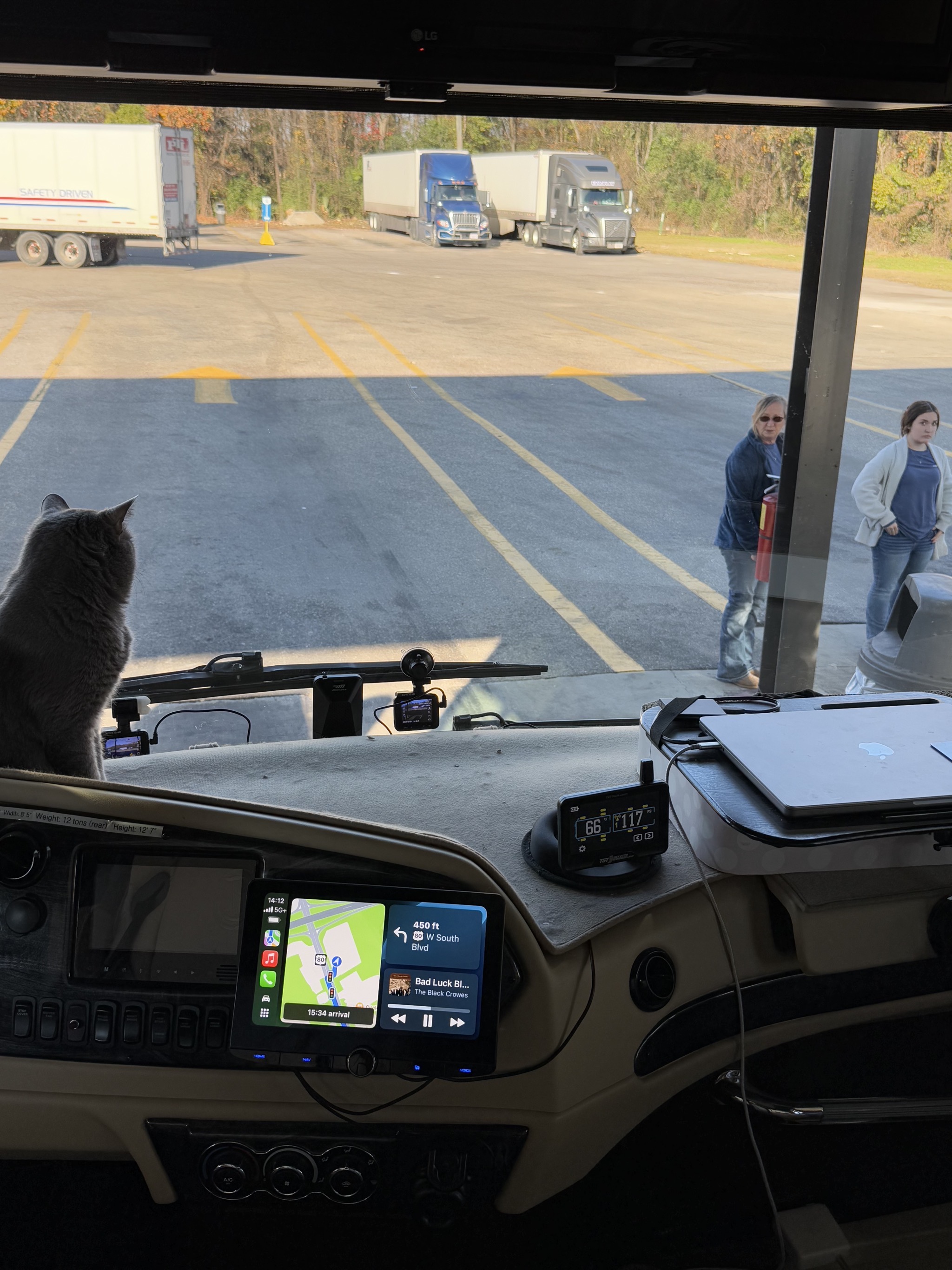 Some women admiring Paladin at a fuel stop