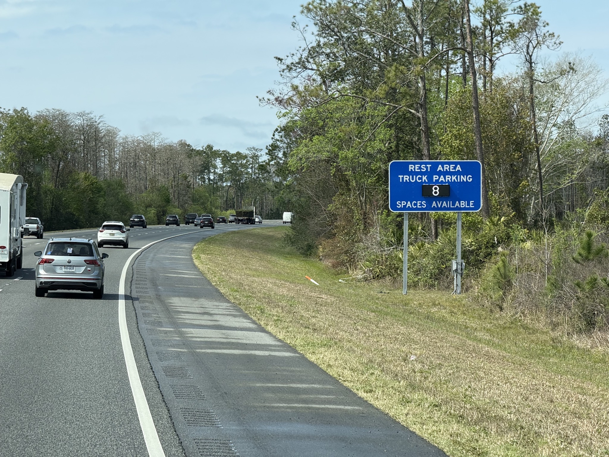 Handy rest area truck parking space available sign