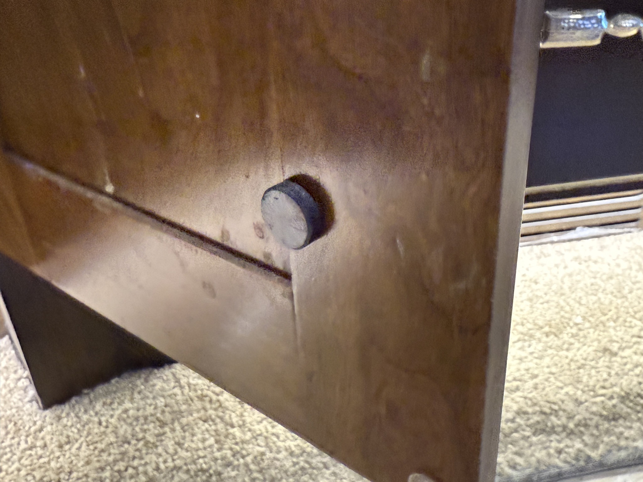 Magnet held on by glue dot