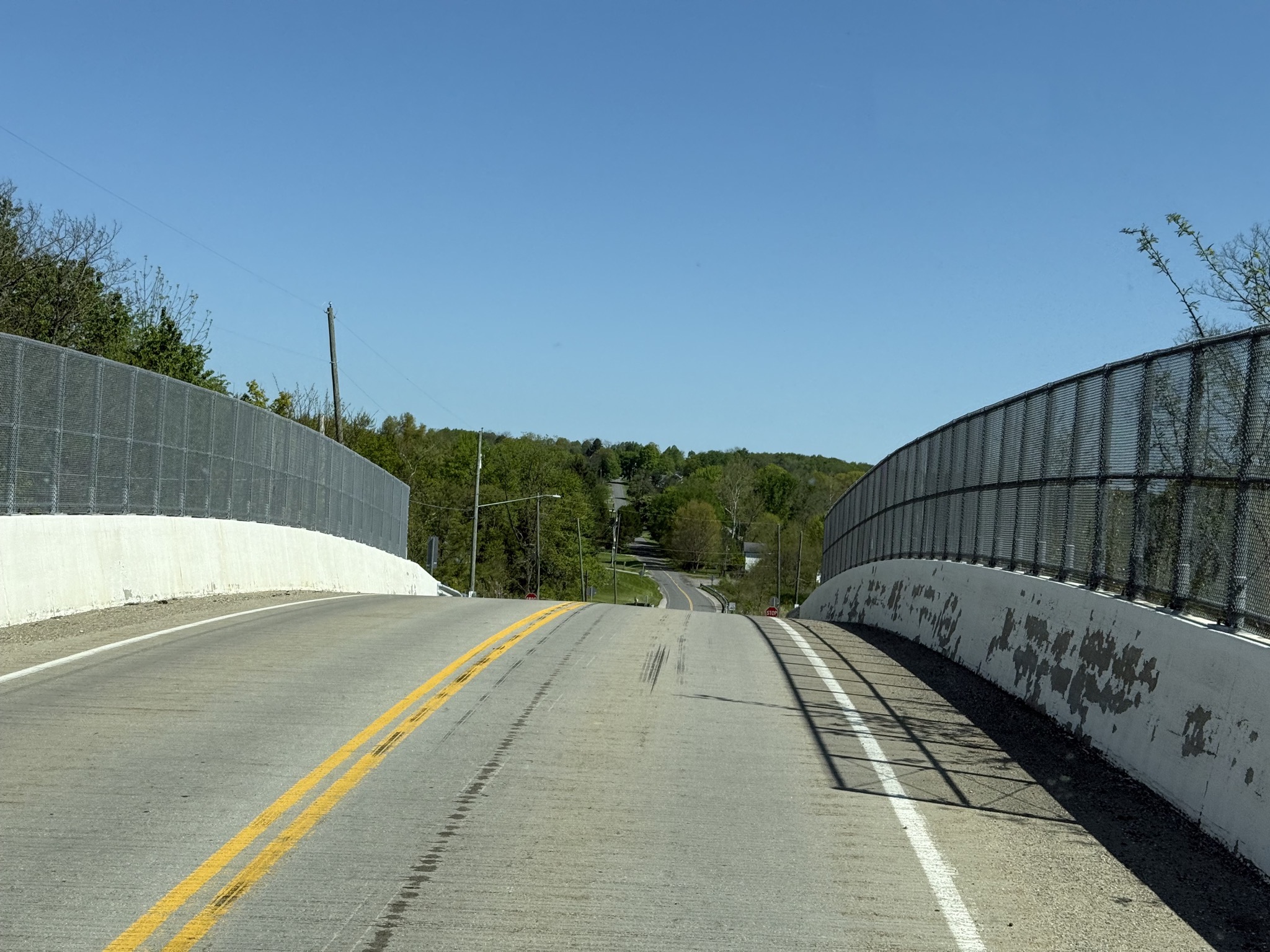 High arching bridge over rail line