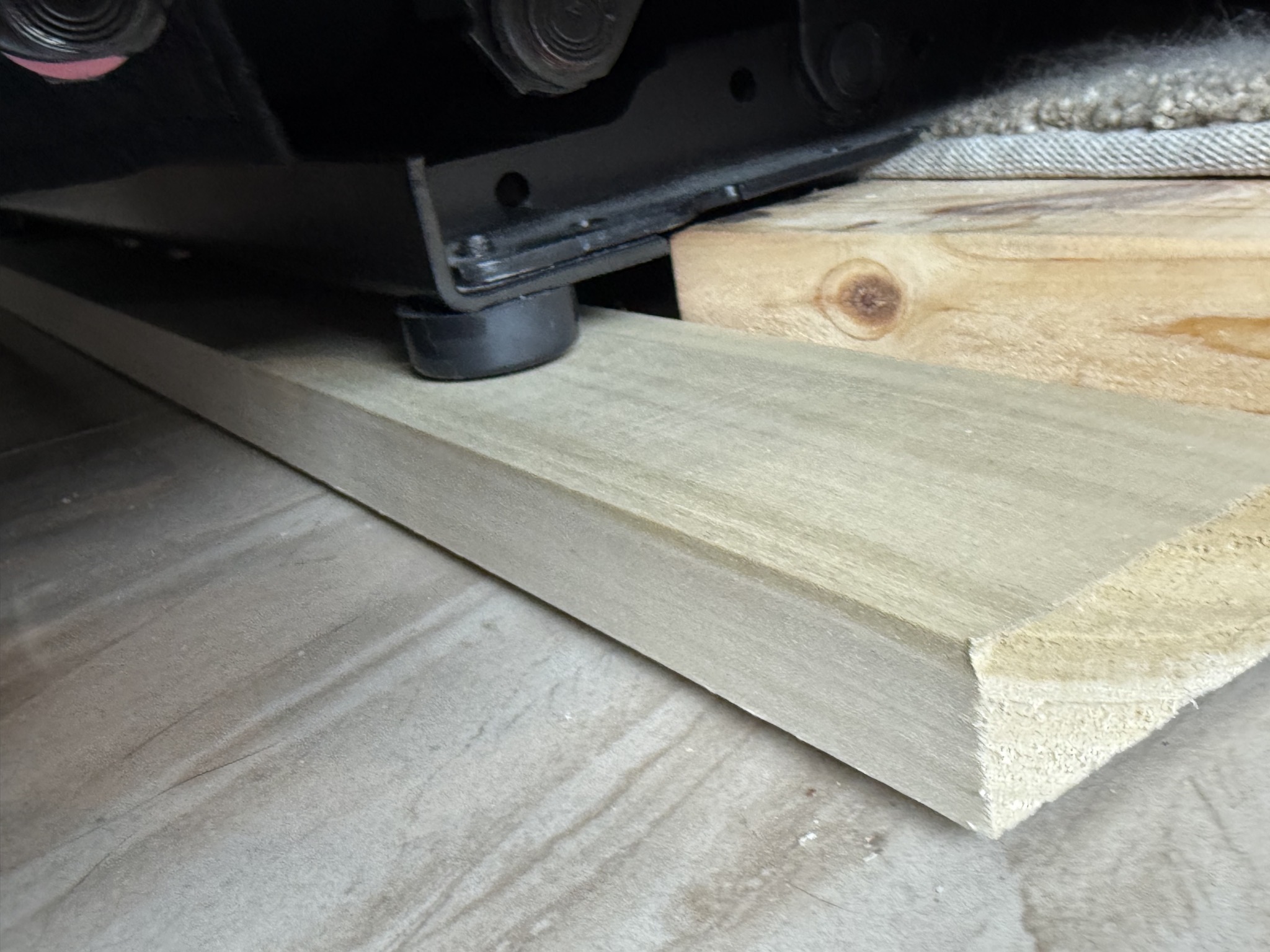 Board under couch feet