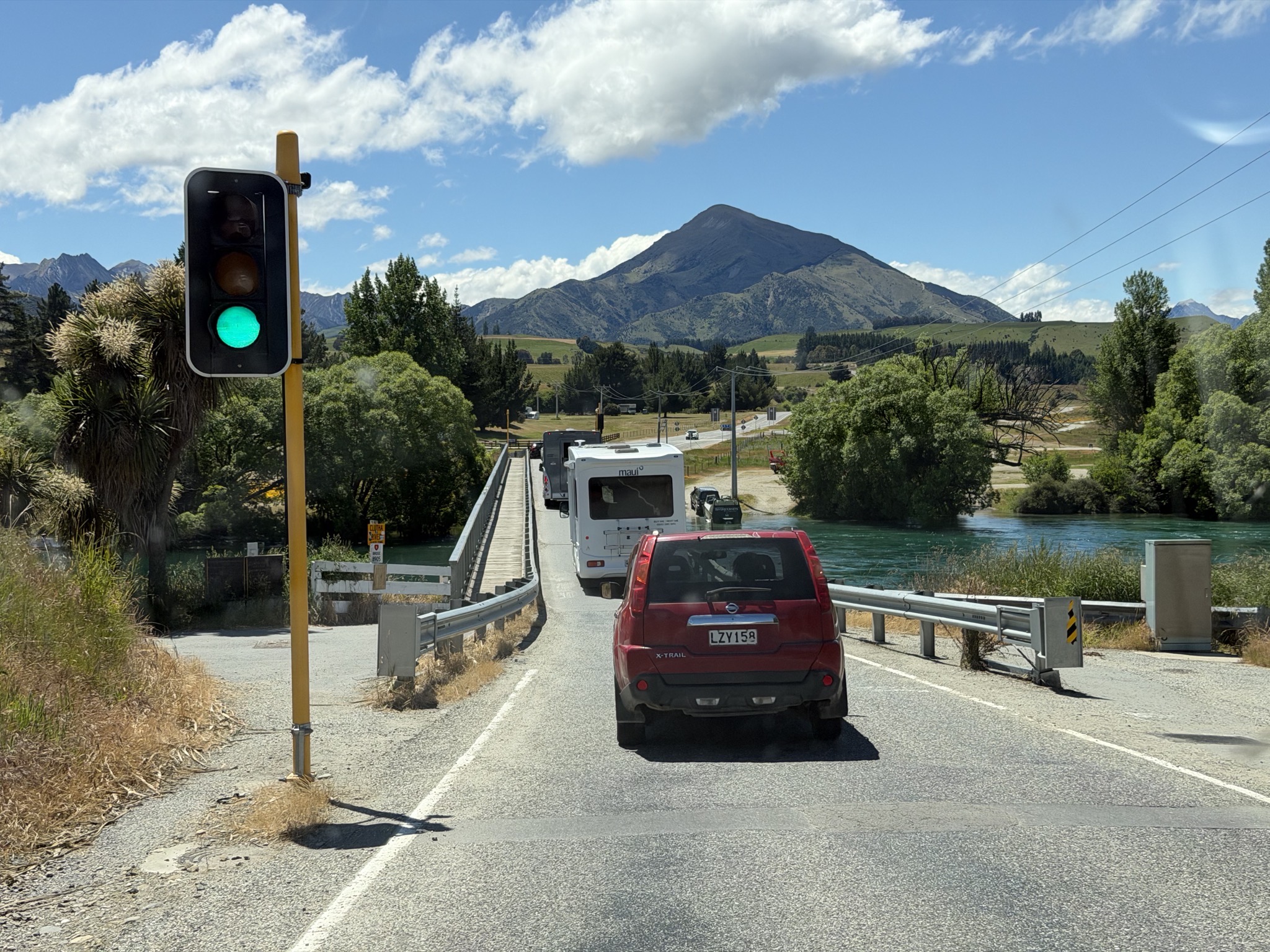One lane bridge with a traffic light